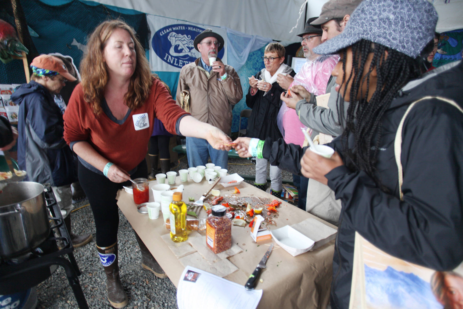 Christina Randall participates in a workshop presented by Maria Finn, author of “The Whole Fish, How Adventurous Eating of Seafood Will Make you Healthier, Sexier and Help Save the Ocean” on how to use every part of the salmon Aug. 7, 2016 at Salmonfest 2016 in Ninilchik, Alaska. (File Photo by Kelly Sullivan/ Peninsula Clarion)