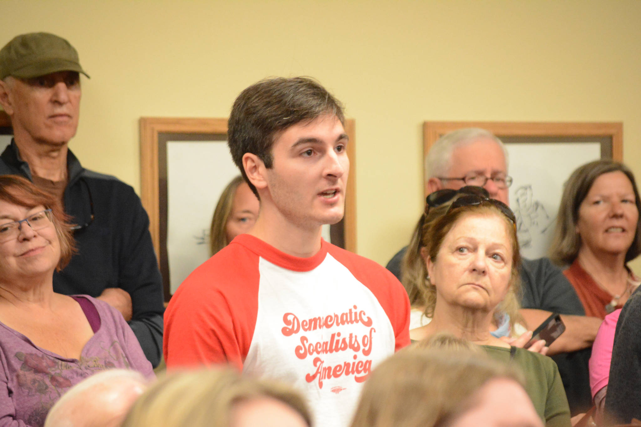 Tim Higginbotham, co-chair of Anchorage Democratic Socialists of America, asks Sen. Lisa Murkowski, R-Alaska, if she would support a single-payer health care system. Murkowski spoke at a town hall meeting on health care Friday, July 7, 2017, at Homer City Hall. About 150 packed the Cowles Council Chambers to share their concerns about health care. Three members of the DSA visited Homer for Murkowski’s visit.