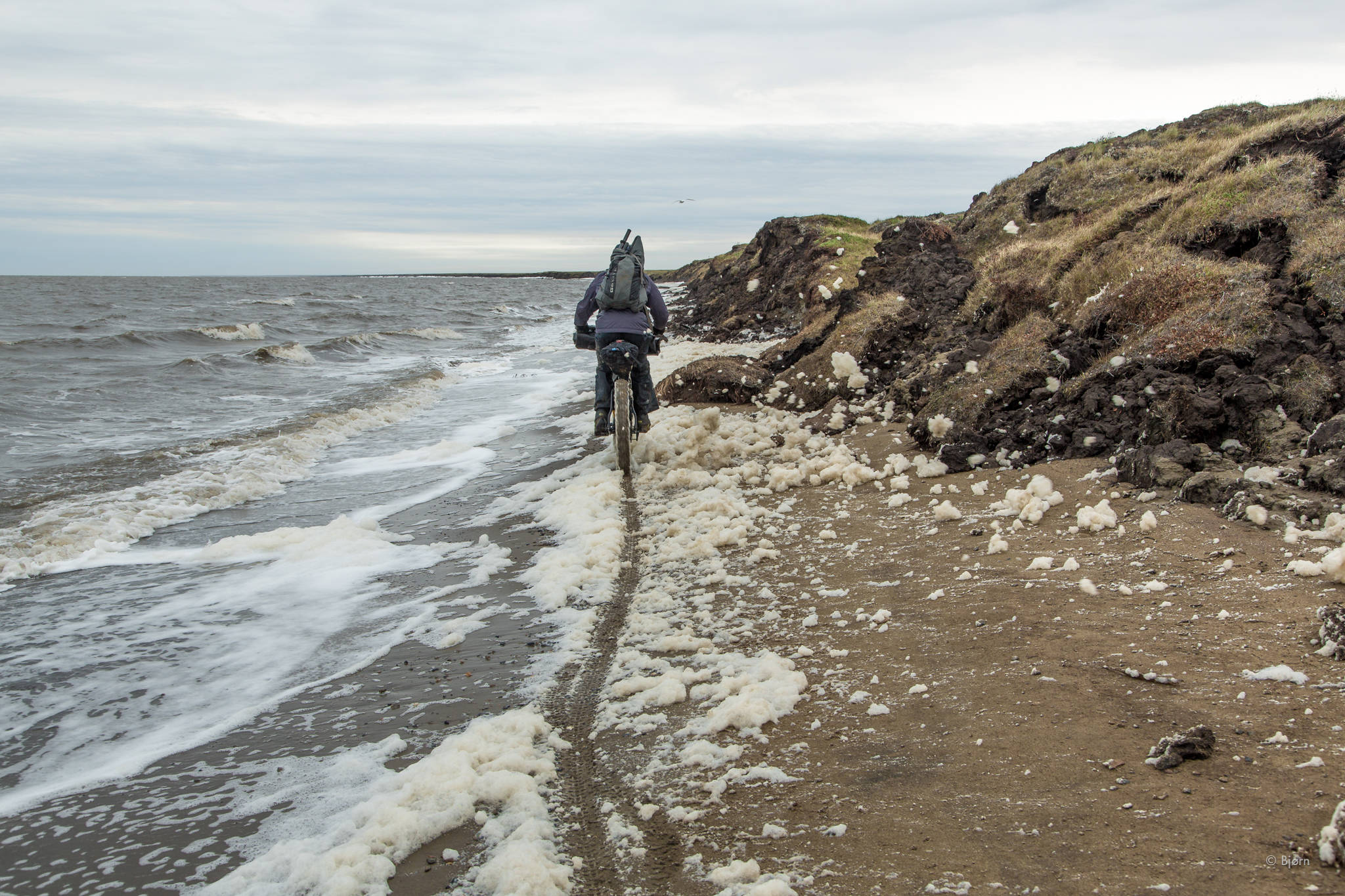 Some sections of beach were so narrow the fat bikers had to skirt the surf and sea foam. (Photo courtesy Bjørn Olson)