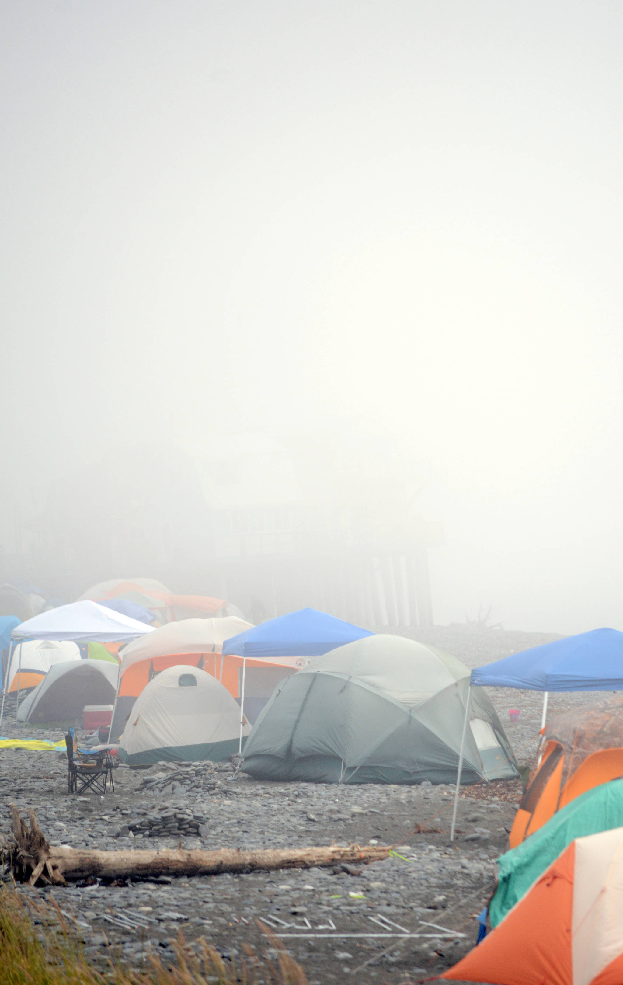 Lost in the mist: Fog shrouds a campground on the Homer Spit beach last Saturday. Tents and motorhomes crowded the beaches and Spit.