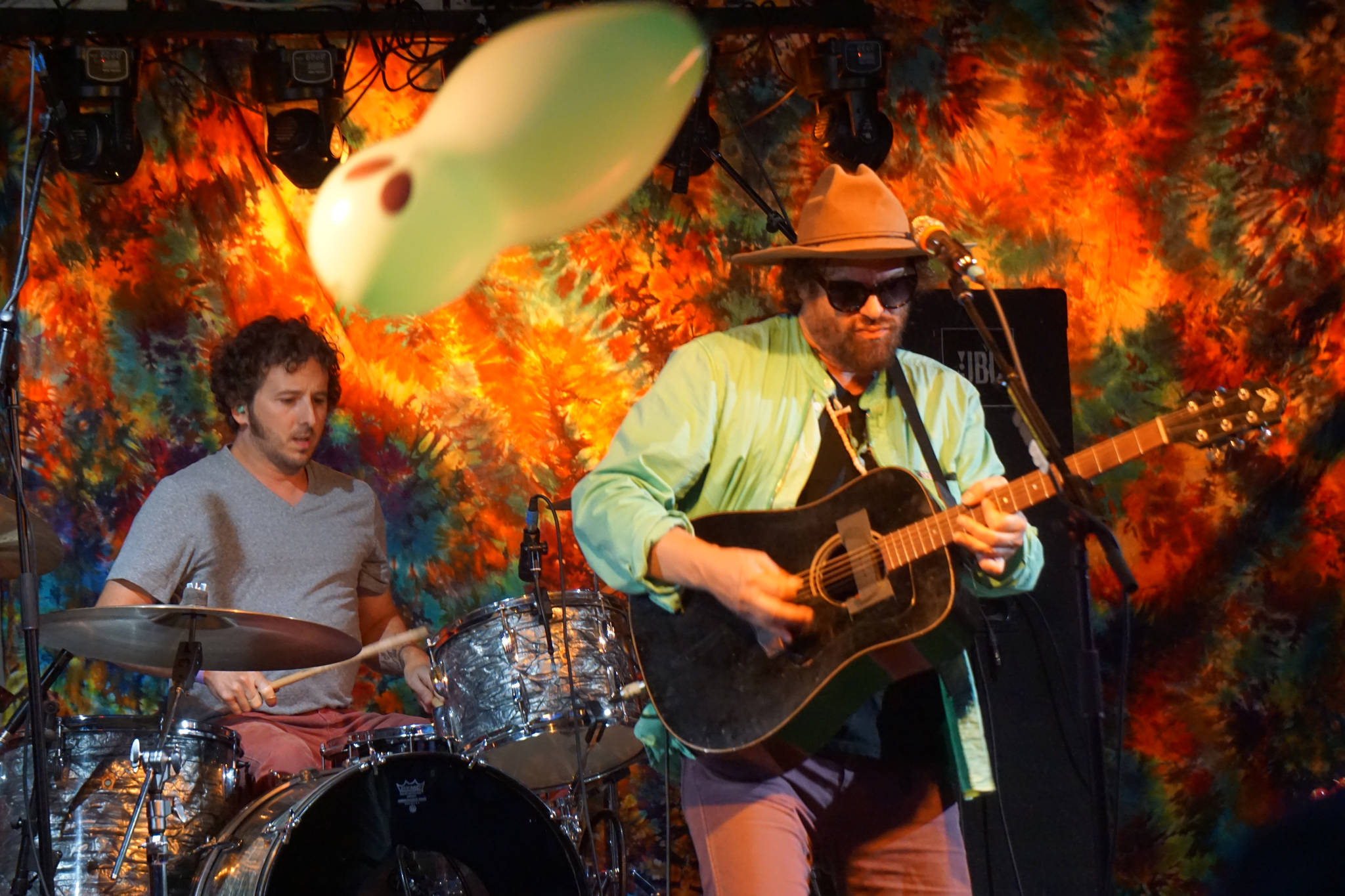 Zil Fessler, left, and Michael Glabicki of Rusted Root perform on Saturday night, Aug. 5, 2017, at Salmonfest, Ninilchik, Alaska. A balloon bounces over the crowd. (Photo by Michael Armstrong, Homer News)