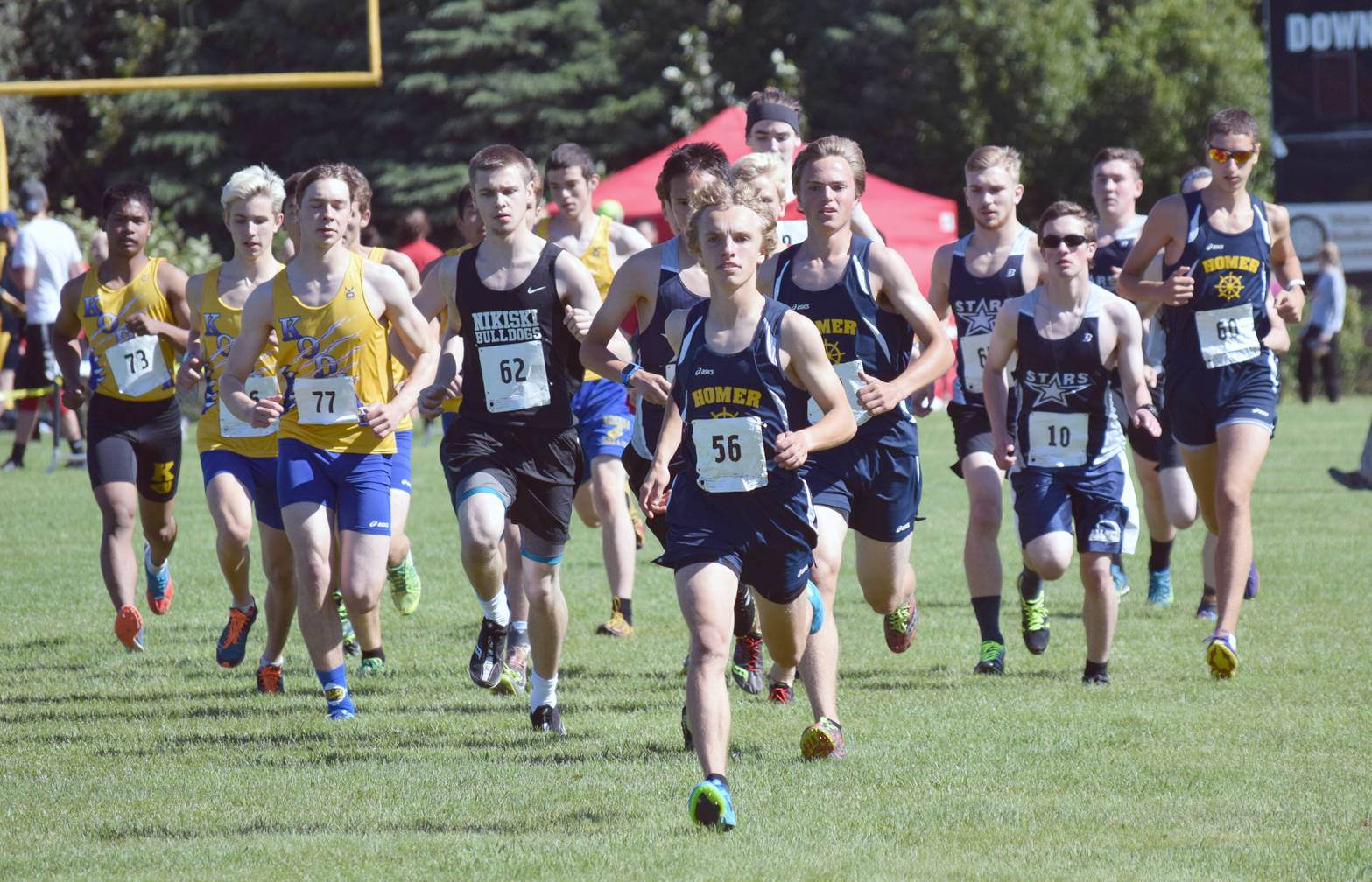 Homer’s Jacob Davis leads the field at the start of the junior-senior boys race Monday, Aug. 14, 2017 at the Nikiski Class Races at Nikiski High School. Davis would finish second in the race. (Photo by Jeff Helminiak/Peninsula Clarion)