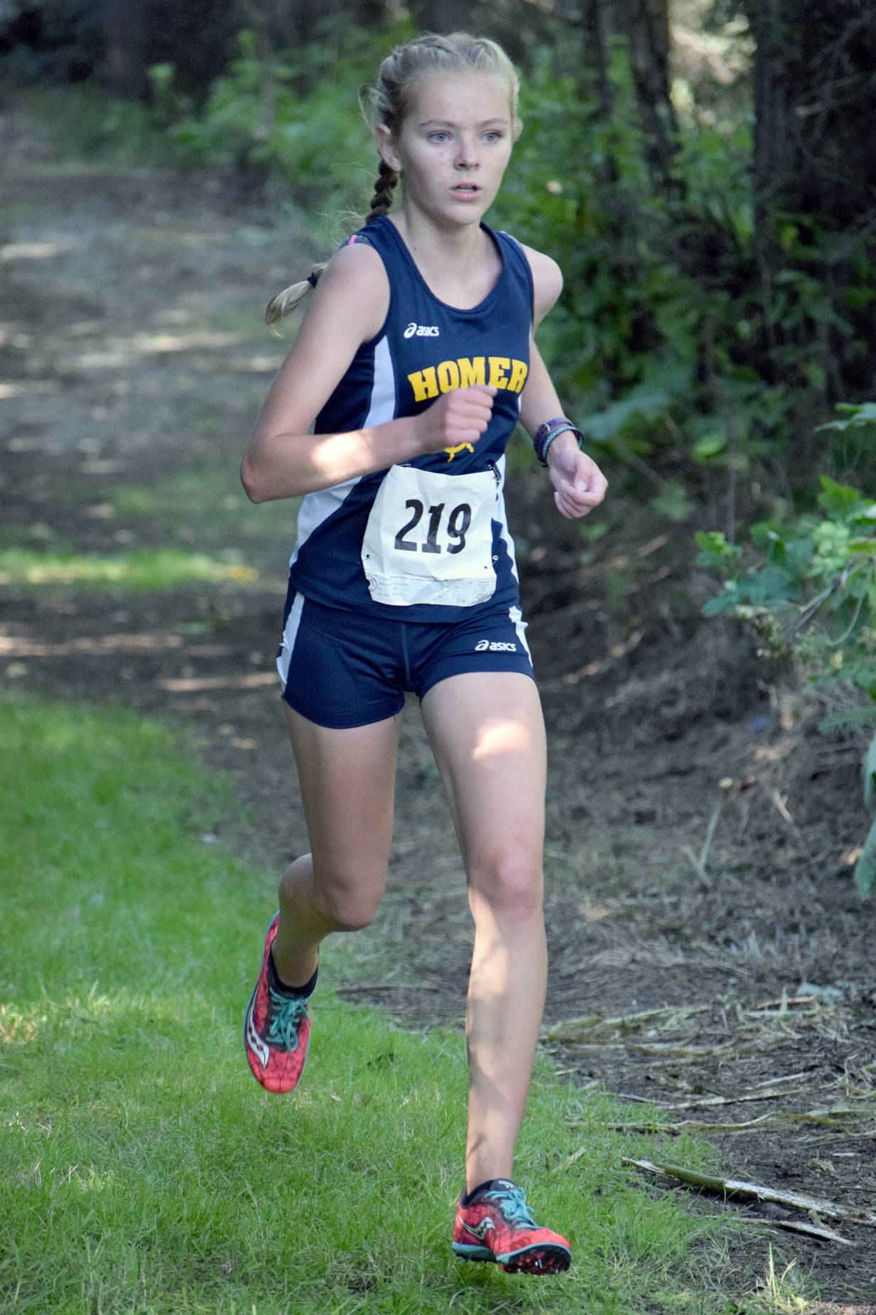 Homer’s Brooke Miller puts the finishing touches on her victory in the freshmen-sophomore girls race Monday, Aug. 14, 2017 at the Nikiski Class Races at Nikiski High School. (Photo by Jeff Helminiak/Peninsula Clarion)