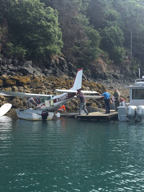 Plane hits rocks in Cove