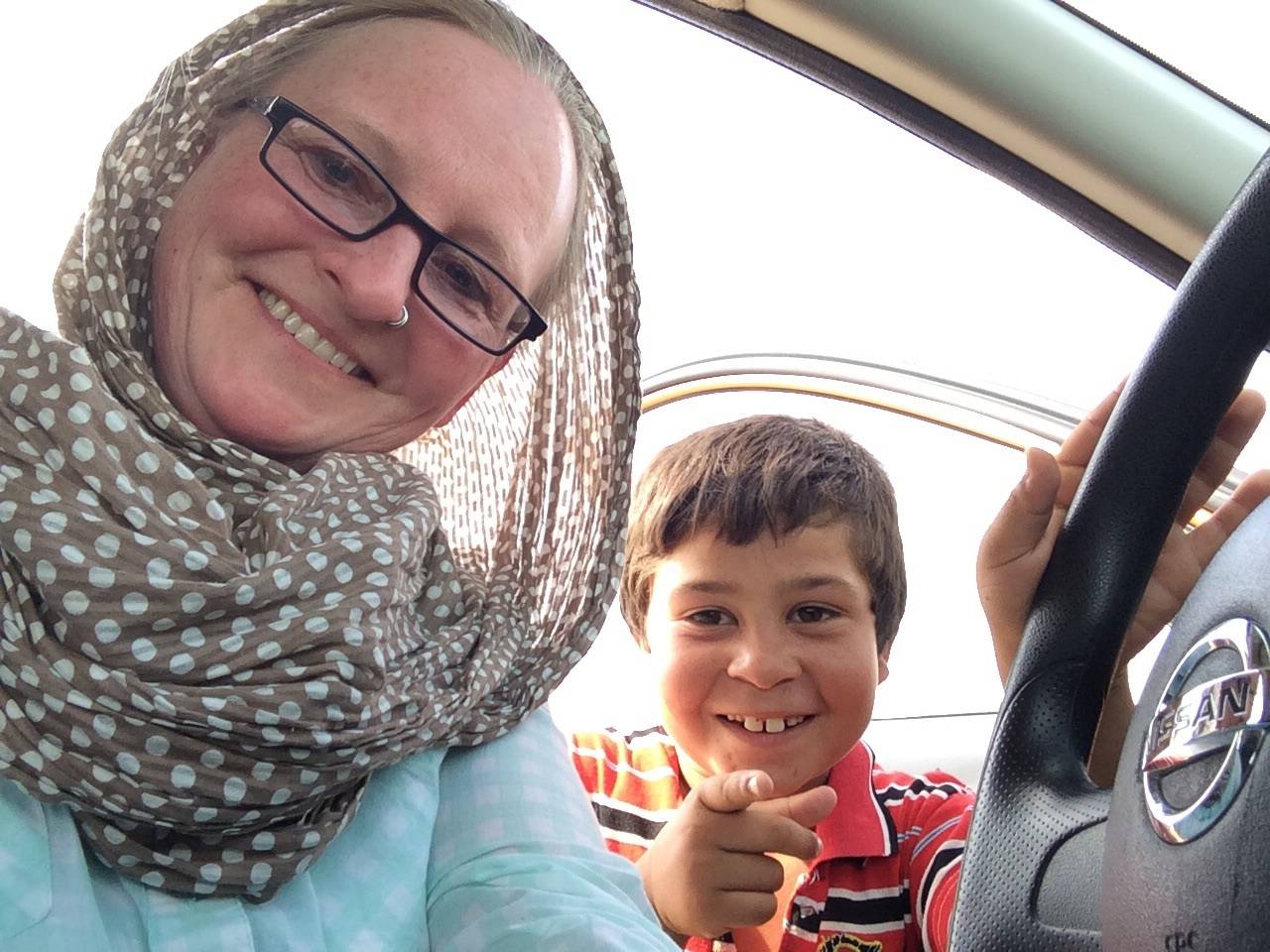 Christina Whiting and a 6-year-old boy named Amad she met during her travels pose for a picture in 2015 in Jordan. (Photo courtesy Christina Whiting)
