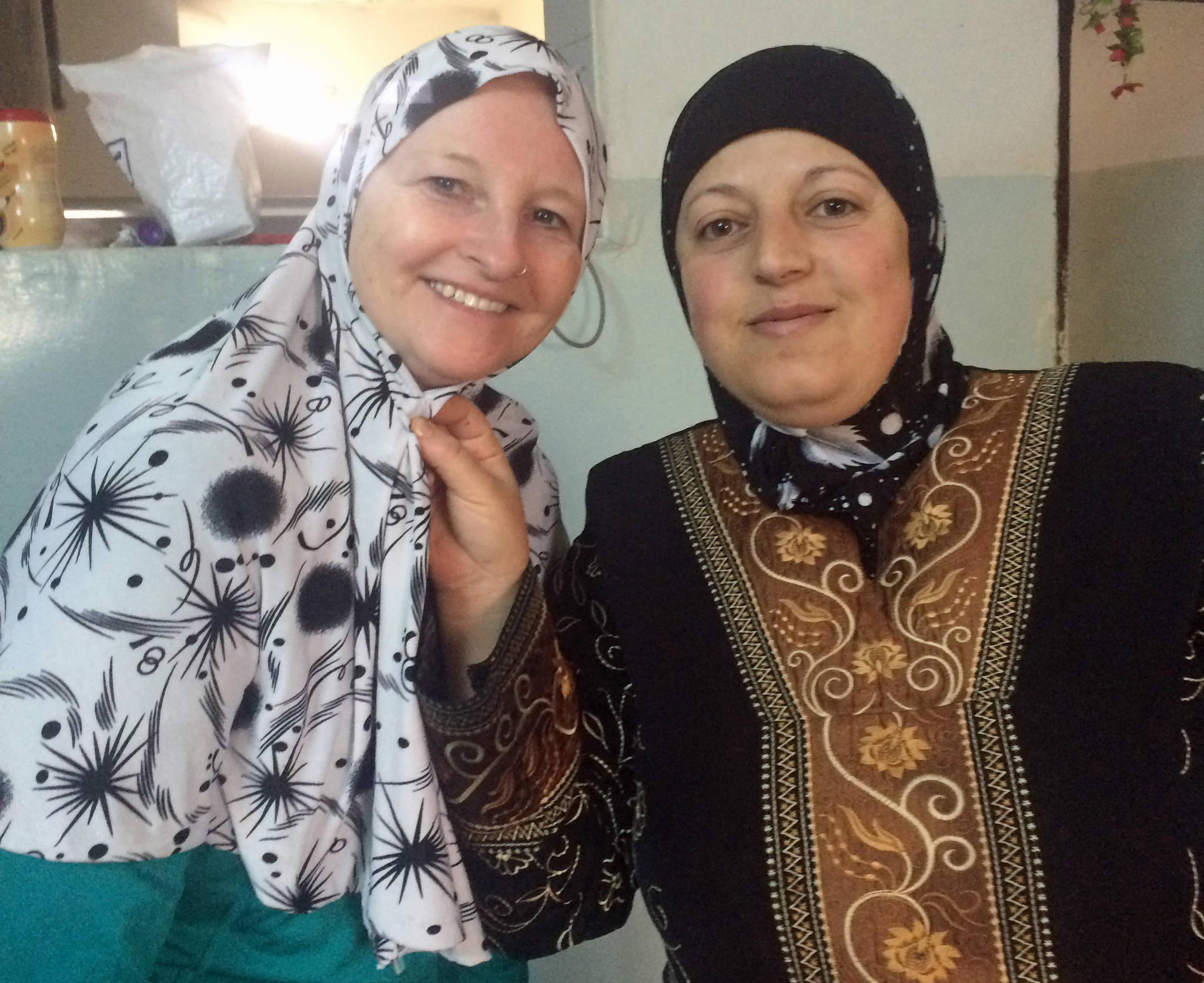 Christina Whiting and a woman named Noor try on hijabs in 2015 in Jordan. (Photo courtesy Christina Whiting)