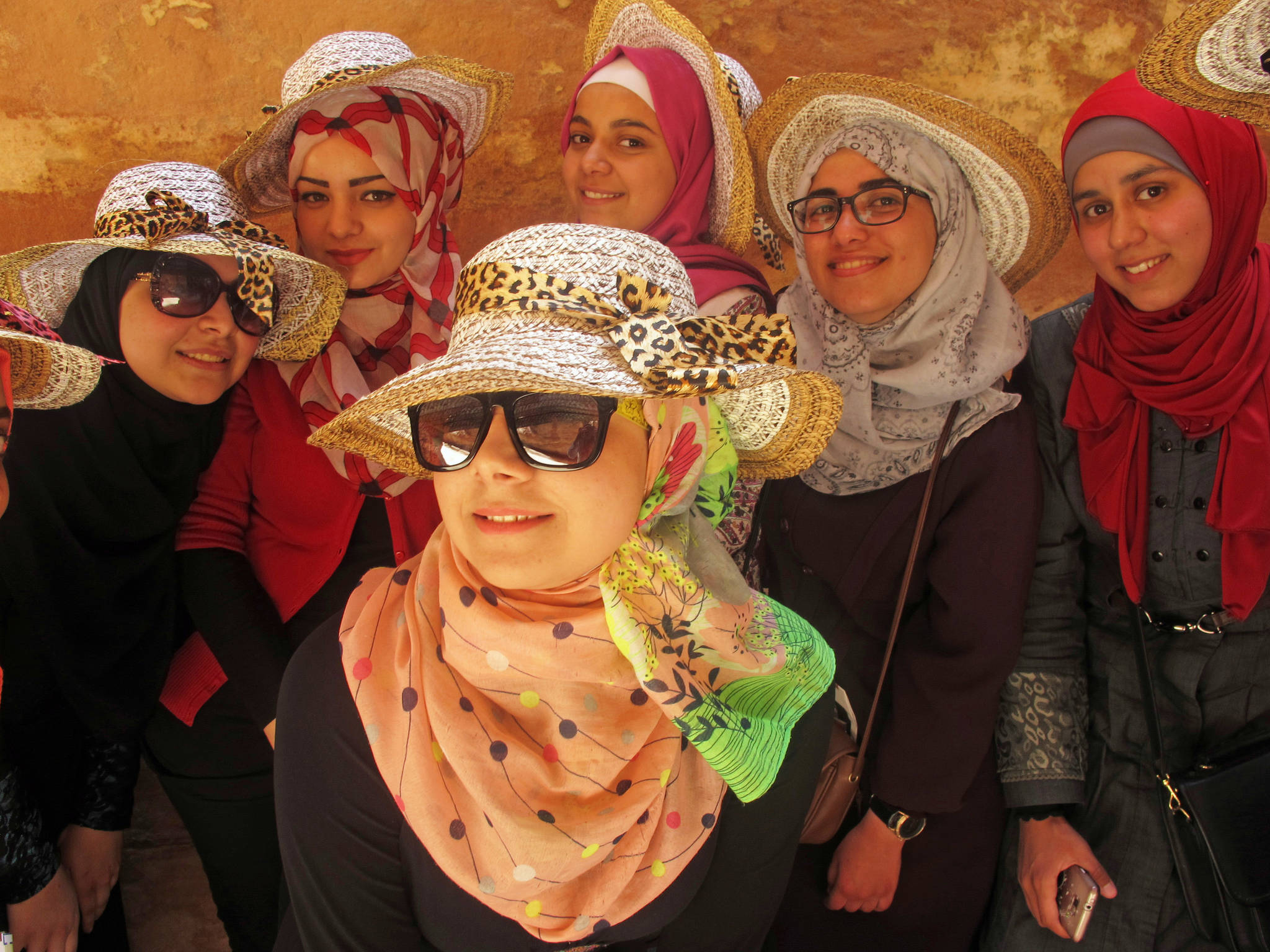 Women pose in scarves in 2015 in Petra, Jordan. (Photo courtesy Christina Whiting)