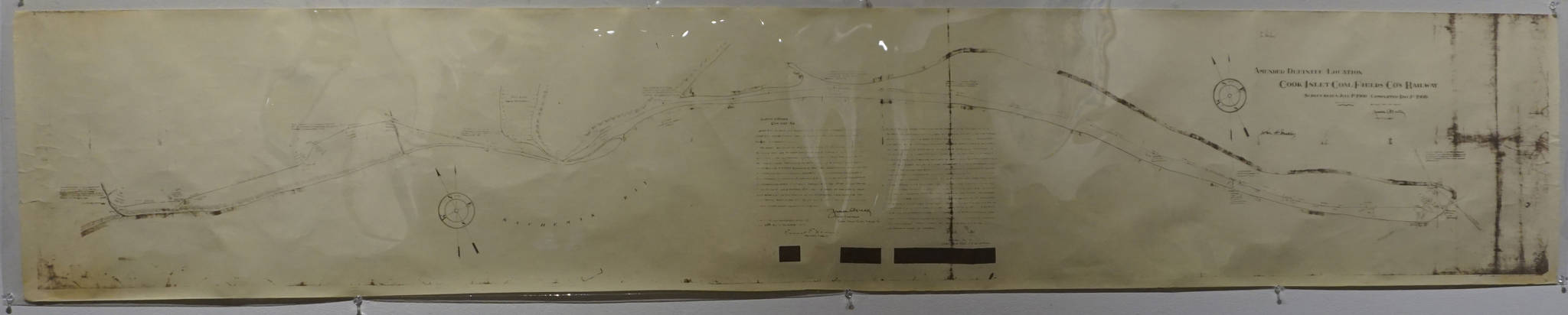 A 1900 map of the Cook Inlet Coal Fields railroad is one of the historic pieces included in cARTography exhibit, shown Tuesday, Aug. 22, 2017 at the Pratt Museum, Homer, Alaska. (Photo by Michael Armstrong, Homer News)