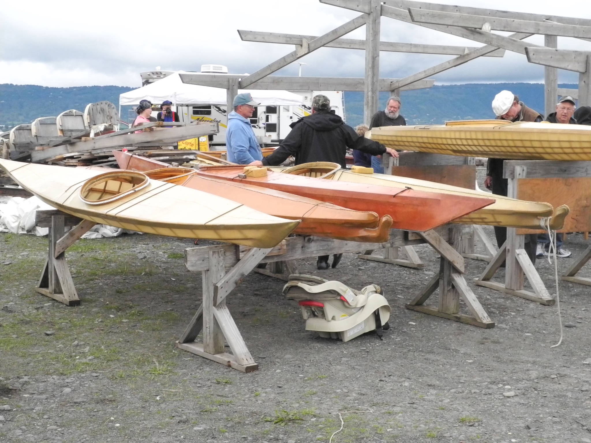 A row of skin kayaks is on display at a previous Kachemak Bay Wooden Boat Festival last Saturday. (Homer News file photo)
