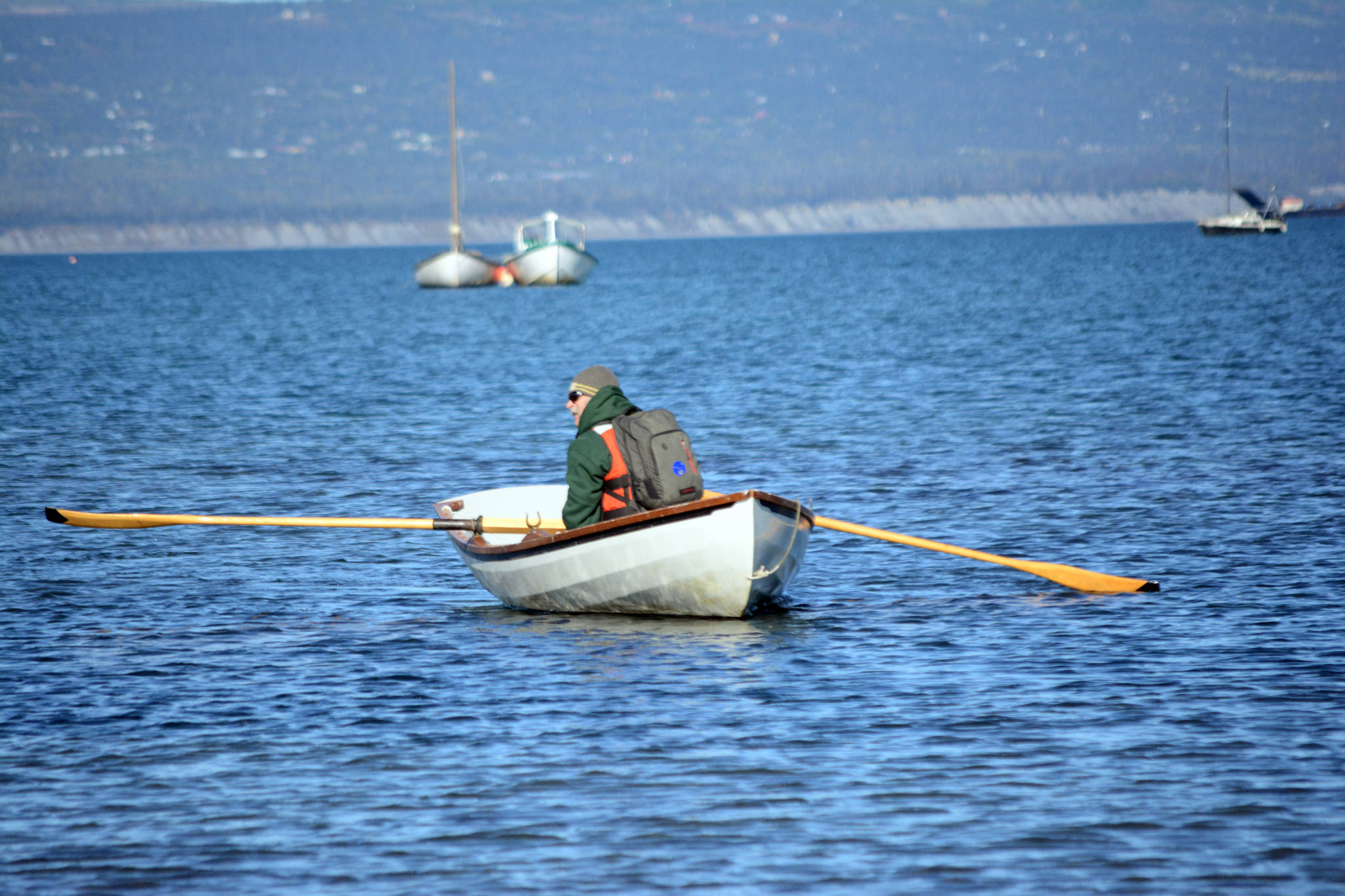 Dave Seaman rows to shore at a previous Kachemak Bay Wooden Boat Festival on the Spit. (Homer News file photo)