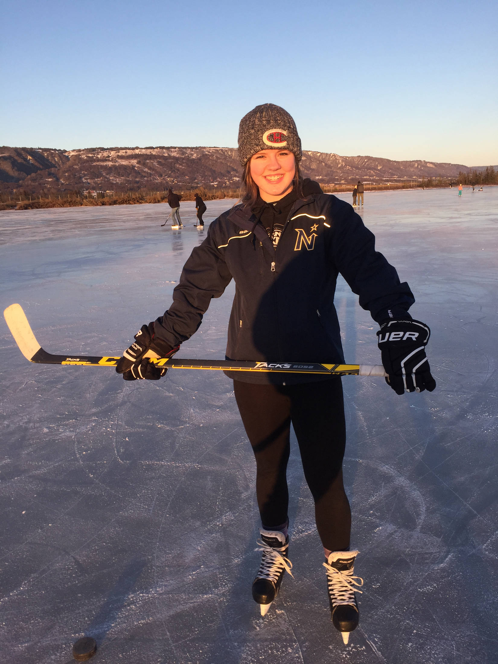 Homer High School senior Mychaela Pitta, pictured here playing hockey on Beluga Lake with friends, is off to a nearly year-long hockey academy in Canada. Having skated since the time she was 3 years old, Pitta hopes to continue with hockey as far as it will take her. (Photo courtesy Lisa Pitta)