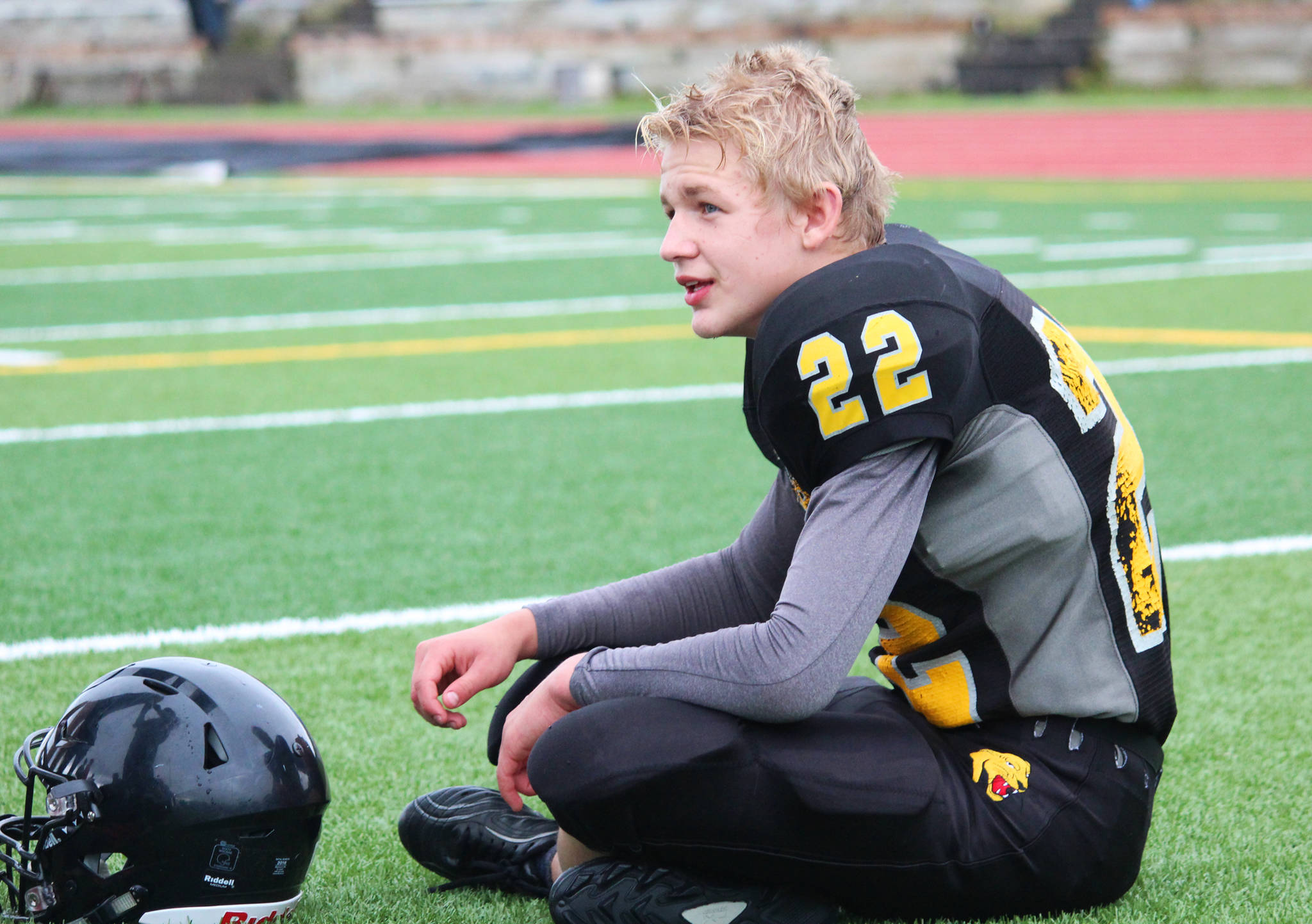 Sophomore Antonin Murachev takes a breather during half time at the Cougar football team’s game against Nikiski High School on Saturday, Sept. 2, 2017 in Homer, Alaska. The Cougars lost 18-40 in their second game of the season. Their first scheduled game was forfeited due to not having enough players at that point in the season. (Photo by Megan Pacer/Homer News)