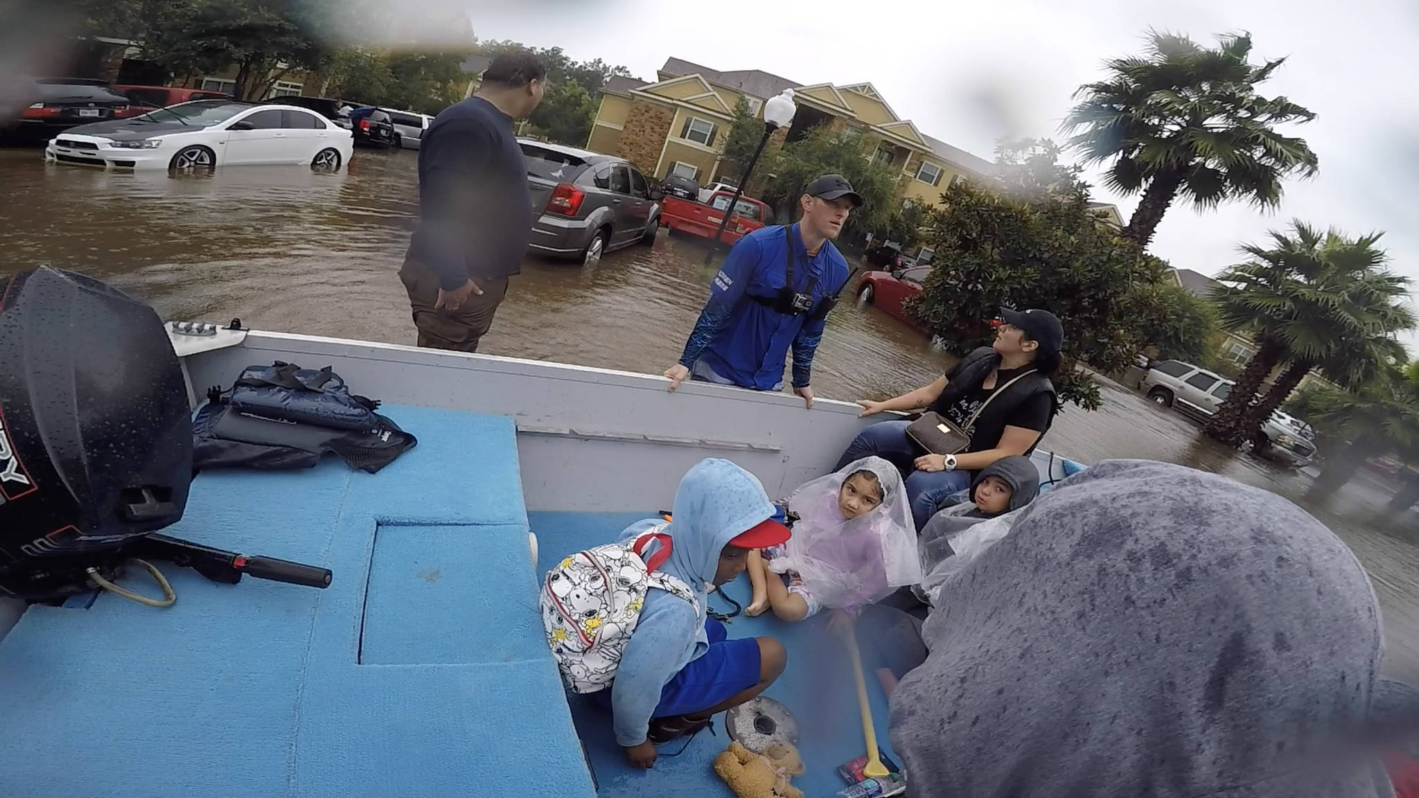 Former Anchor Point resident Chase McKinney, in blue shirt, helps rescue Houston-area flood survivors Aug. 28-30, 2017 in Texas. McKinney and a friend, Israel Lopez, picked up stranded victims and helped get them to high ground in their bass boat. (Photo provided)