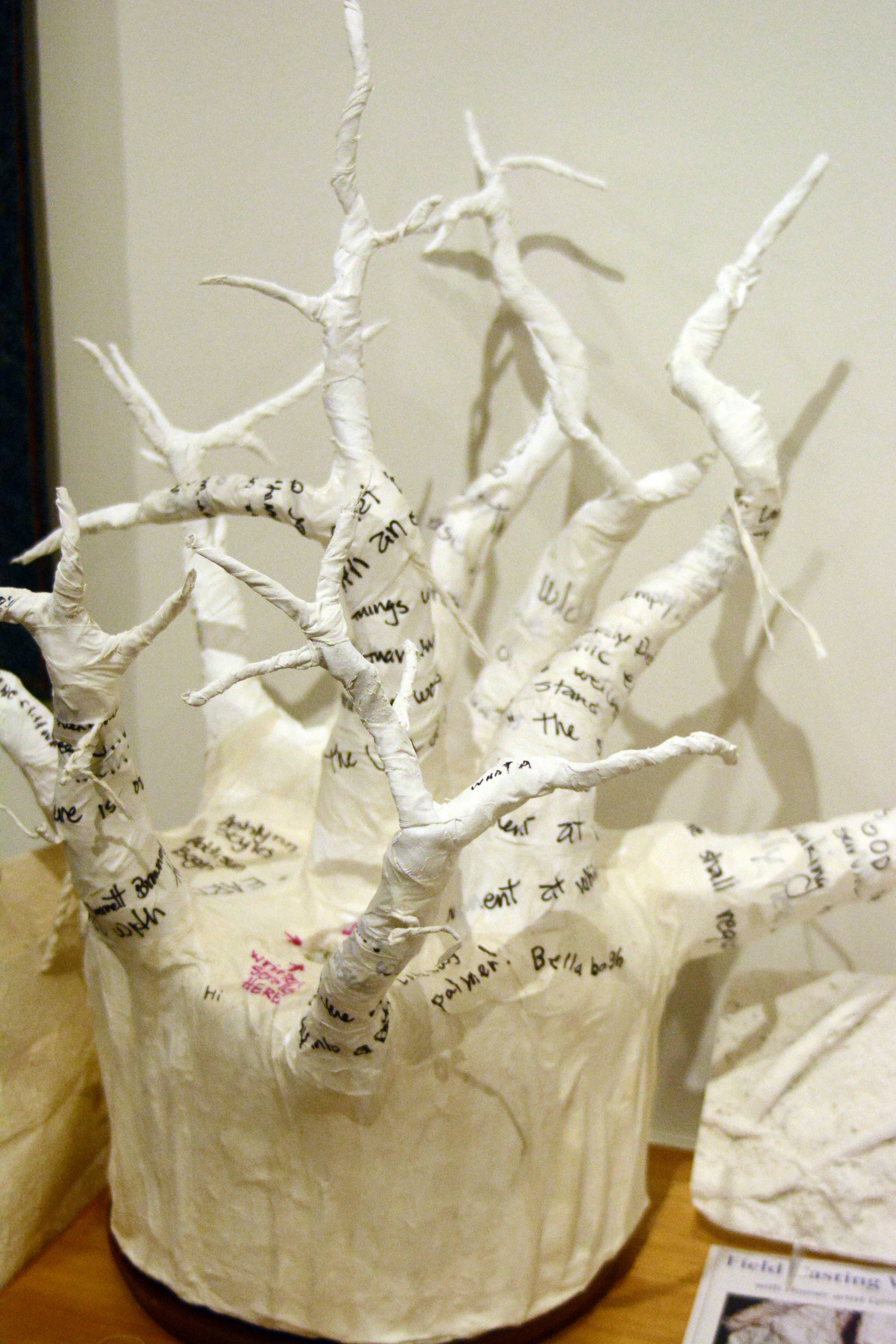 Lynn Marie Naden’s sculpture at the Pratt Museum invites visitors to submit thoughts on the subject of “Root,” write them on a piece of paper and put it in the sculpture. The slips of paper ultimately will be used in a larger sculpture she will create. (Photo by Michael Armstrong/Homer News)