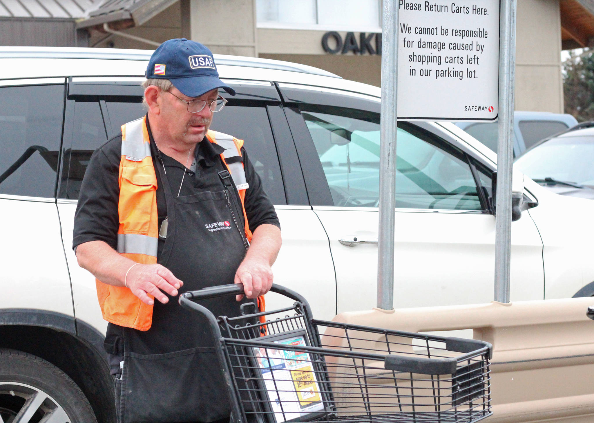 Homer resident Terry Elliott works his last shift at Safeway on his birthday before retiring Tuesday, Sept. 5, 2017 in Homer, Alaska. Elliott, who was worked there since approximately 1989, turned 62 on Tuesday. He has also volunteered with the Boy Scouts of America for decades. (Photo by Megan Pacer/Homer News)