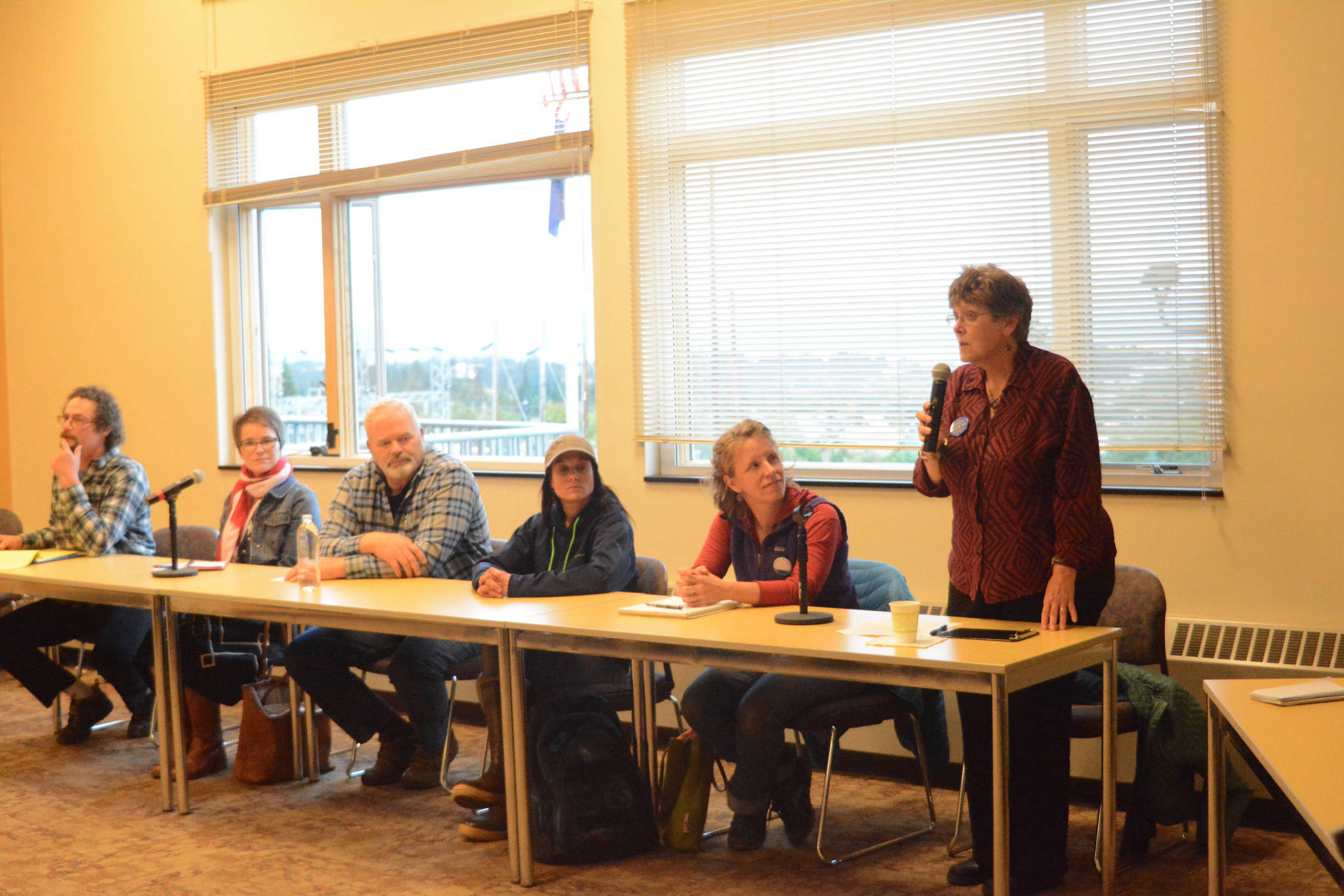 Homer City Council candidate Caroline Venuti, right, speaks at a candidates forum on Thursday, Sept. 21, at Kachemak Bay Campus. Sponsored by KBBI Public Radio, the candidates answered questions from the audience as well as from KBBI and Homer News reporters. From left to right are candidates Andy Kita, Sarah Vance, Dwayne Nustvold Jr., Kimberly Ketter, Rachel Lord and Venuti. Candidate Stephen Mueller could not make the Sept. 21 forum because of a family commitment, but he did attend a Sept. 28 forum at the Homer Elks Lodge sponsored by the Homer Chamber of Commerce and Visitors Center. (Photo by Michael Armstrong, Homer News)