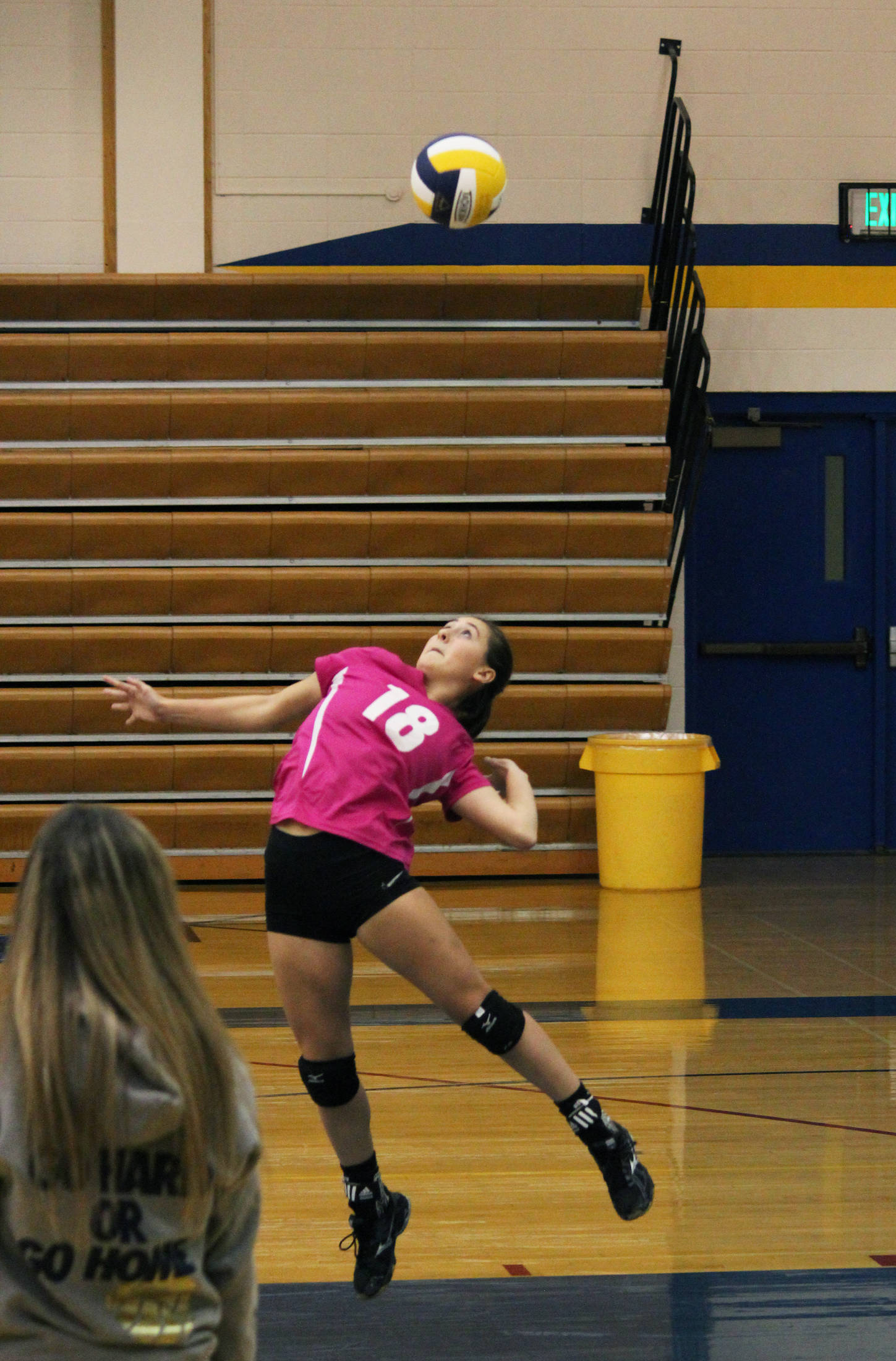 Senior Raisa Basargin serves the ball during the Homer Mariner varsity volleyball team’s game against Anchorage Christian School on Saturday, Sept. 30, 2017 in the Alice Witte Gymnasium in Homer, Alaska. The Mariners fell to ACS three sets to zero. (Photo by Megan Pacer/Homer News)