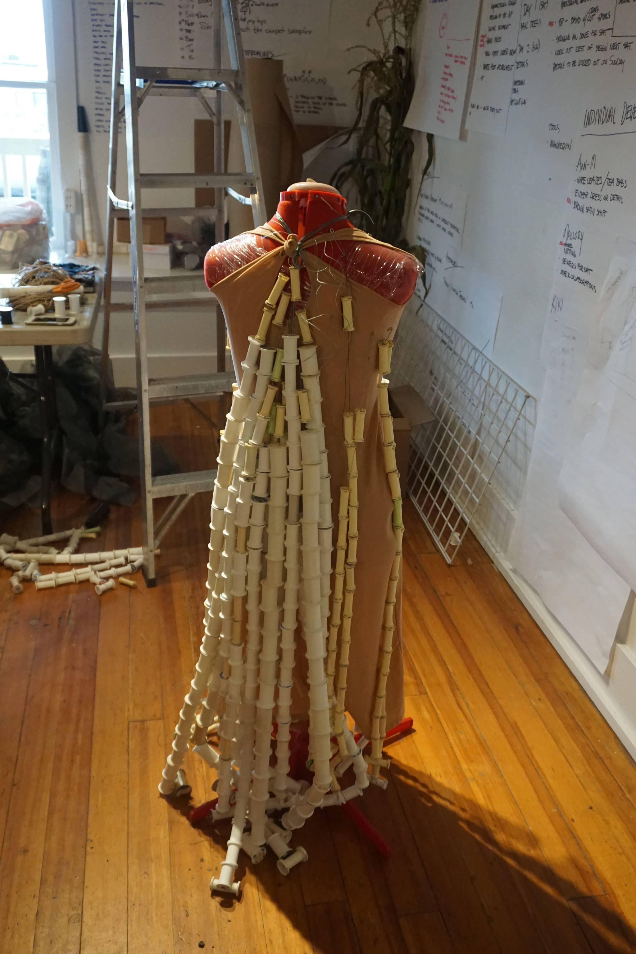 A dress made of sewing thread spindles, shown here Saturday, Oct. 14, 2017 in Homer, Alaska, is one of the Wearable Arts pieces being worked on by participants in a workshop Sheila Wyne held at Bunnell Street Arts Center in October. Wyne is artist in residence at Bunnell at a residency sponsored by the Homer Fiber Arts Collective. (Photo by Michael Armstrong)