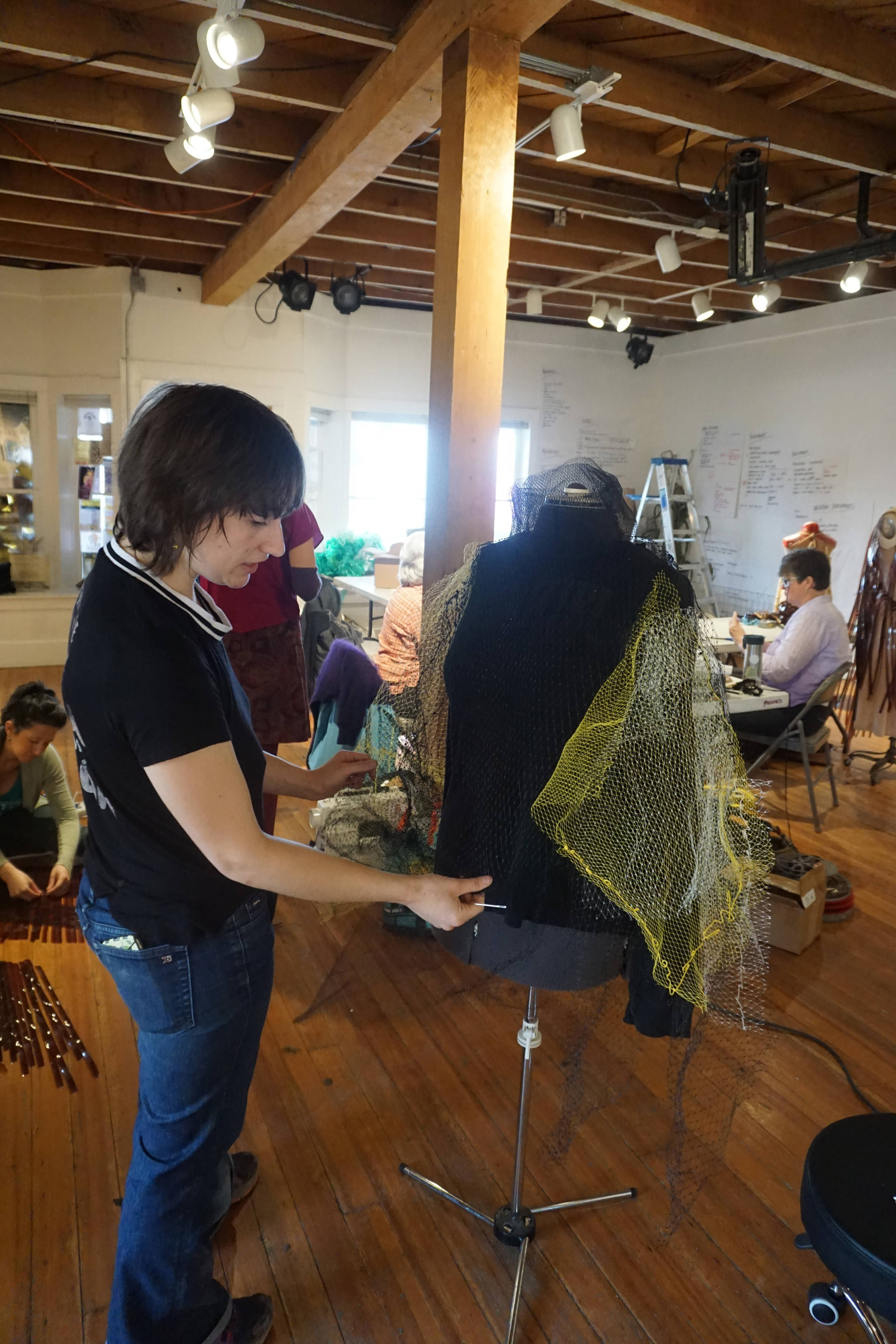 Mallory Drover works on a Wearable Arts piece Saturday, Oct. 14, 2017 at a workshop with Sheila Wyne at the Bunnell Street Arts Center in Homer, Alaska. Wyne is artist in residence at Bunnell. The residecy is sponsored by the Homer Fiber Arts Collective. Drover is a Homer student and a visual arts major attending Antioch College, Yellow Springs, Ohio. She took Wyne’s workshop as part of work study at Antioch. (Photo by Michael Armstrong)