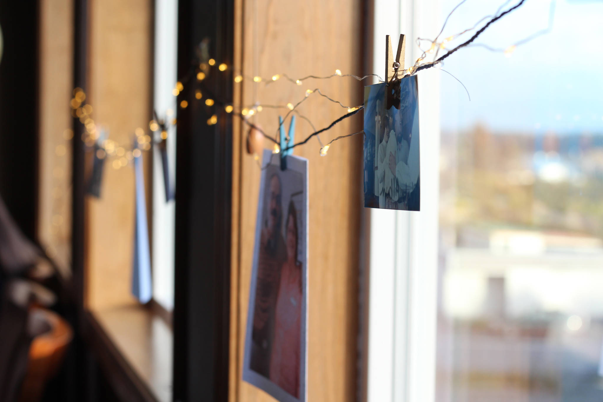 Photos and notes of thanks about Mary Lou Kelsey, a longtime certified nurse midwife in Himer, decorate the windows during a retirement party for her Friday, Oct. 13, 2017 at the Best Western in Homer, Alaska. (Photo by Megan Pacer/Homer News)