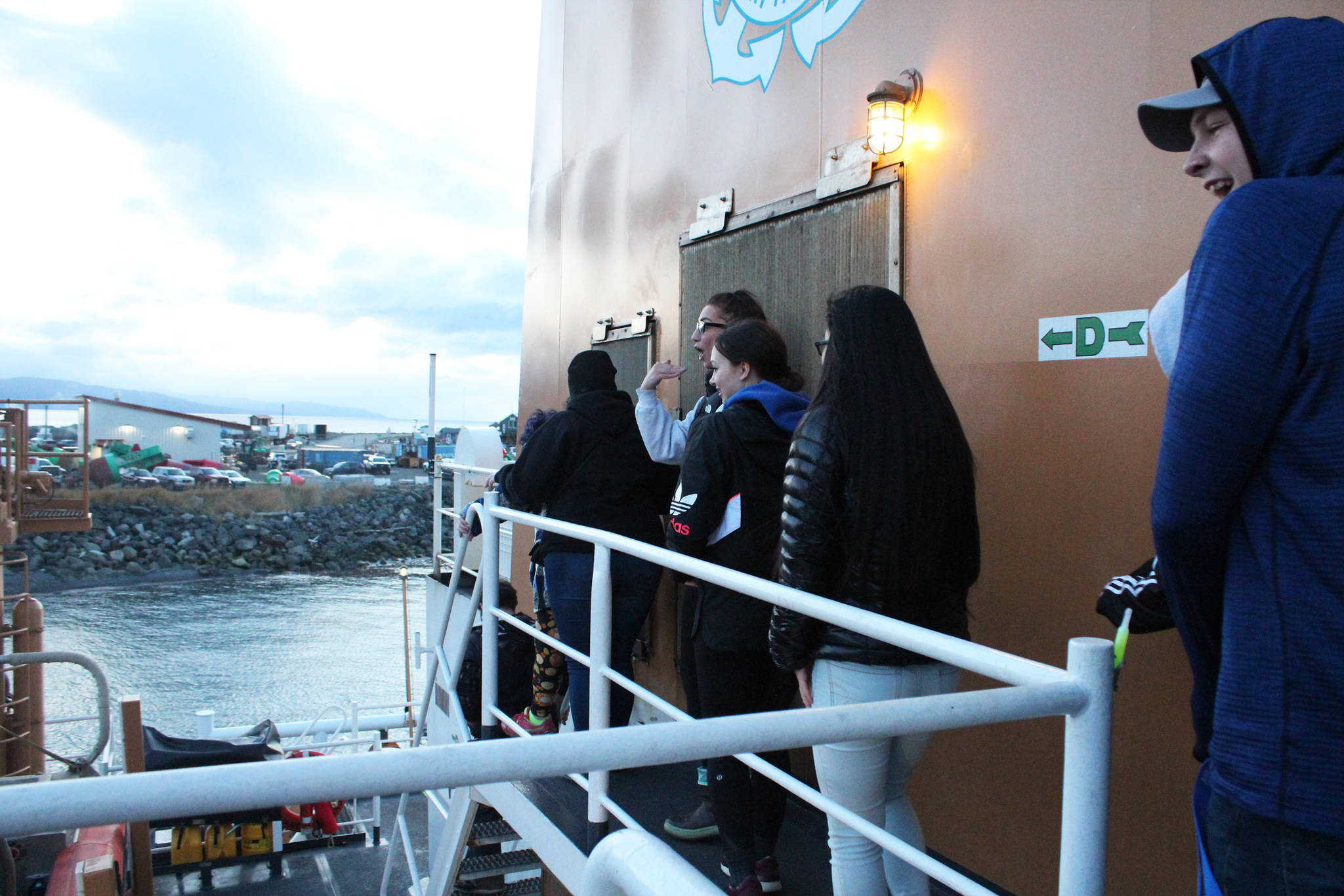 A group of young people make their way across the U.S. Coast Guard Cutter Hickory at the start of their spooky tour in this year’s Haunted Hickory event Thursday, Oct. 26, 2017 in Homer, Alaska. They and hundreds of others donated two nonperishable items to get scared by the ship’s crew members and their families during the annual event. (Photo by Megan Pacer/Homer News)