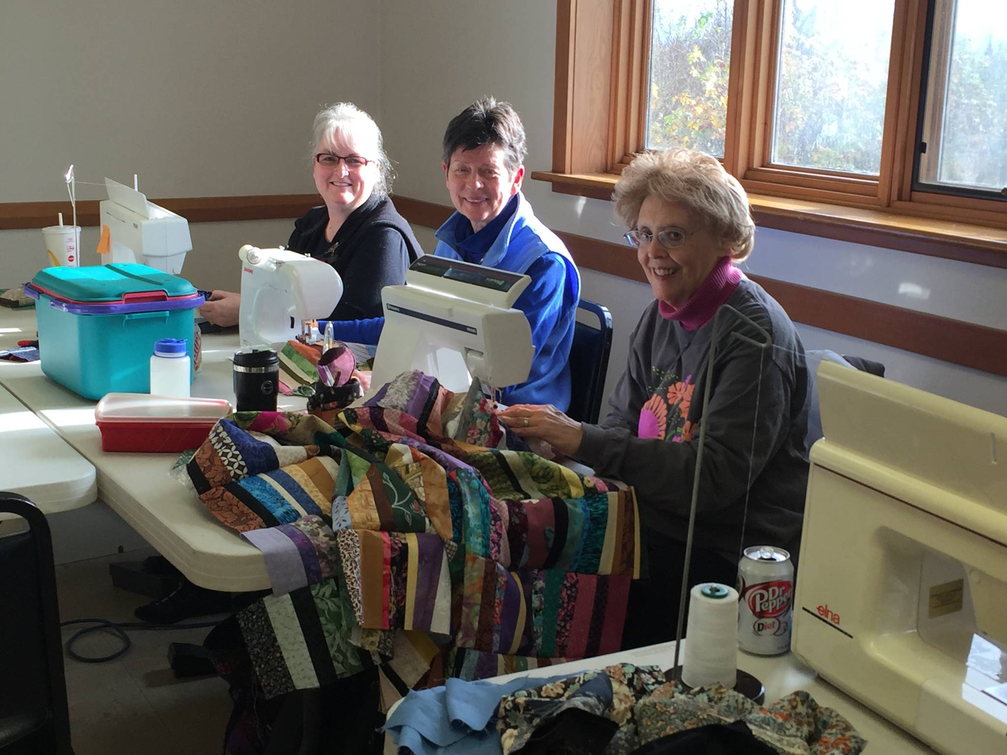 Members of the Kachemak Bay Quilters work on their quilts (Photo provided)