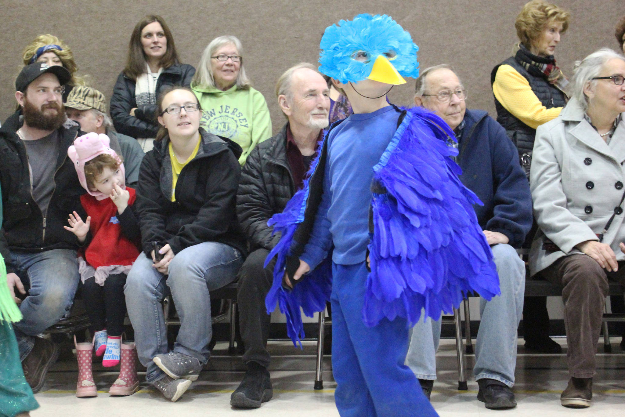 Elementary school student Cohen McBride walks as a blue bird in the Paul Banks Elementary School Halloween costume parade Tuesday, Oct. 31, 2017 at the school in Homer, Alaska. (Photo by Megan Pacer/Homer News)