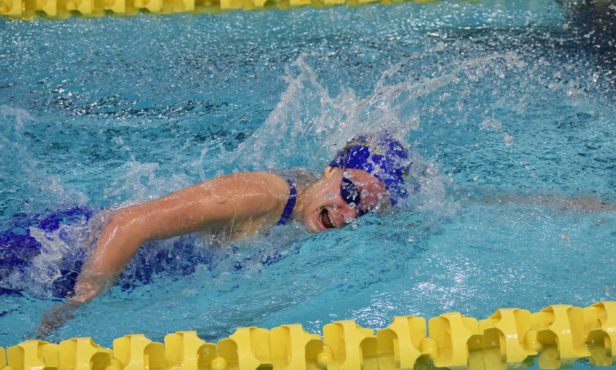 Homer’s Madison Story races in the girls 200-yard Individual Medley Saturday, Nov. 4, 2017 at the ASAA First National Bank State Swimming & Diving Championships at the Bartlett High pool in Anchorage, Alaska. (Photo by Joey Klecka/Peninsula Clarion)