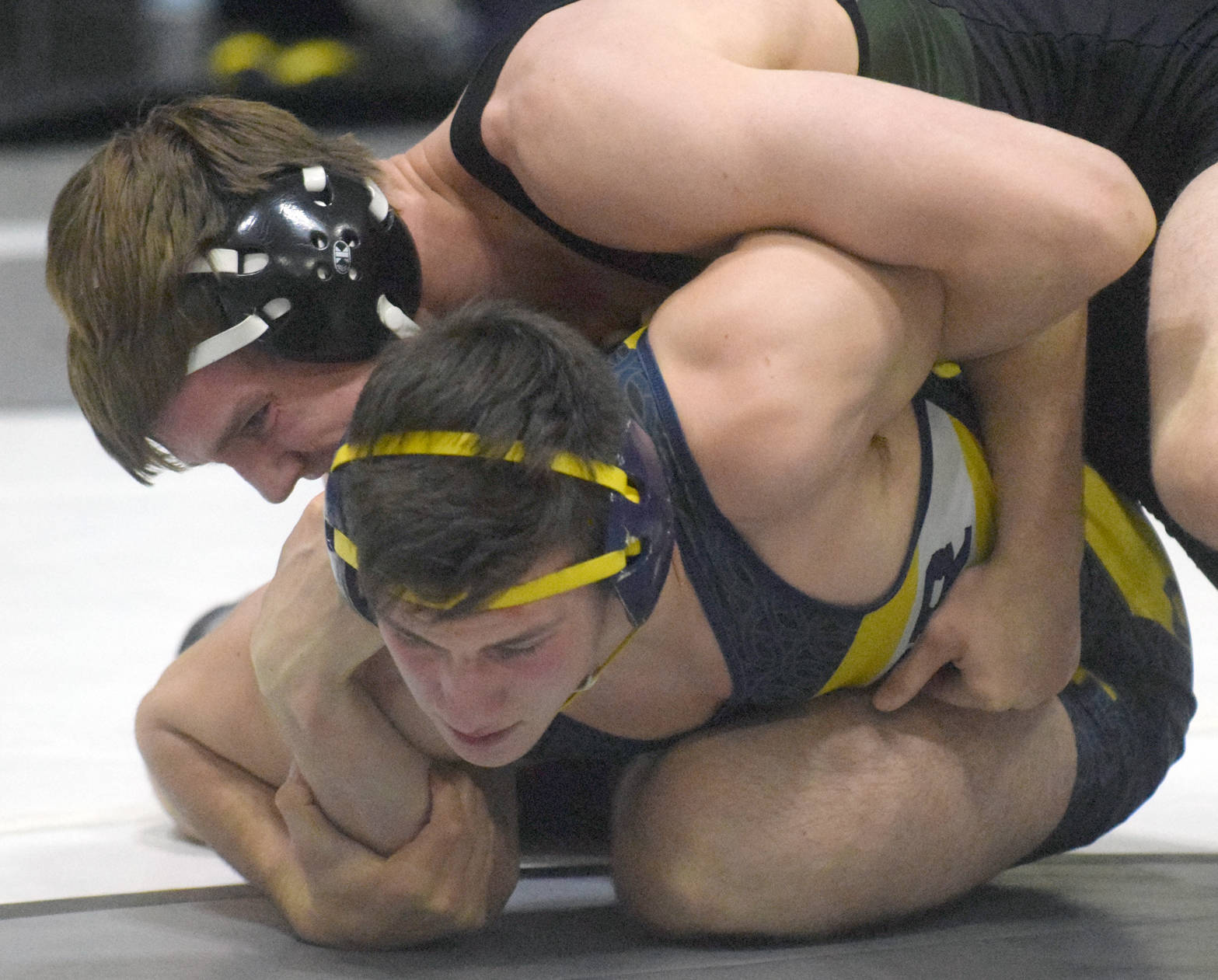 Colony’s Caleb Hopkins controls Homer’s Tristen Cook at 182 pounds en route to a 2-1 decision Saturday, Nov. 11, 2017, in the championship dual of the Peninsula Duals at Nikiski High School in Nikiski, Alaska. (Photo by Jeff Helminiak/Peninsula Clarion)