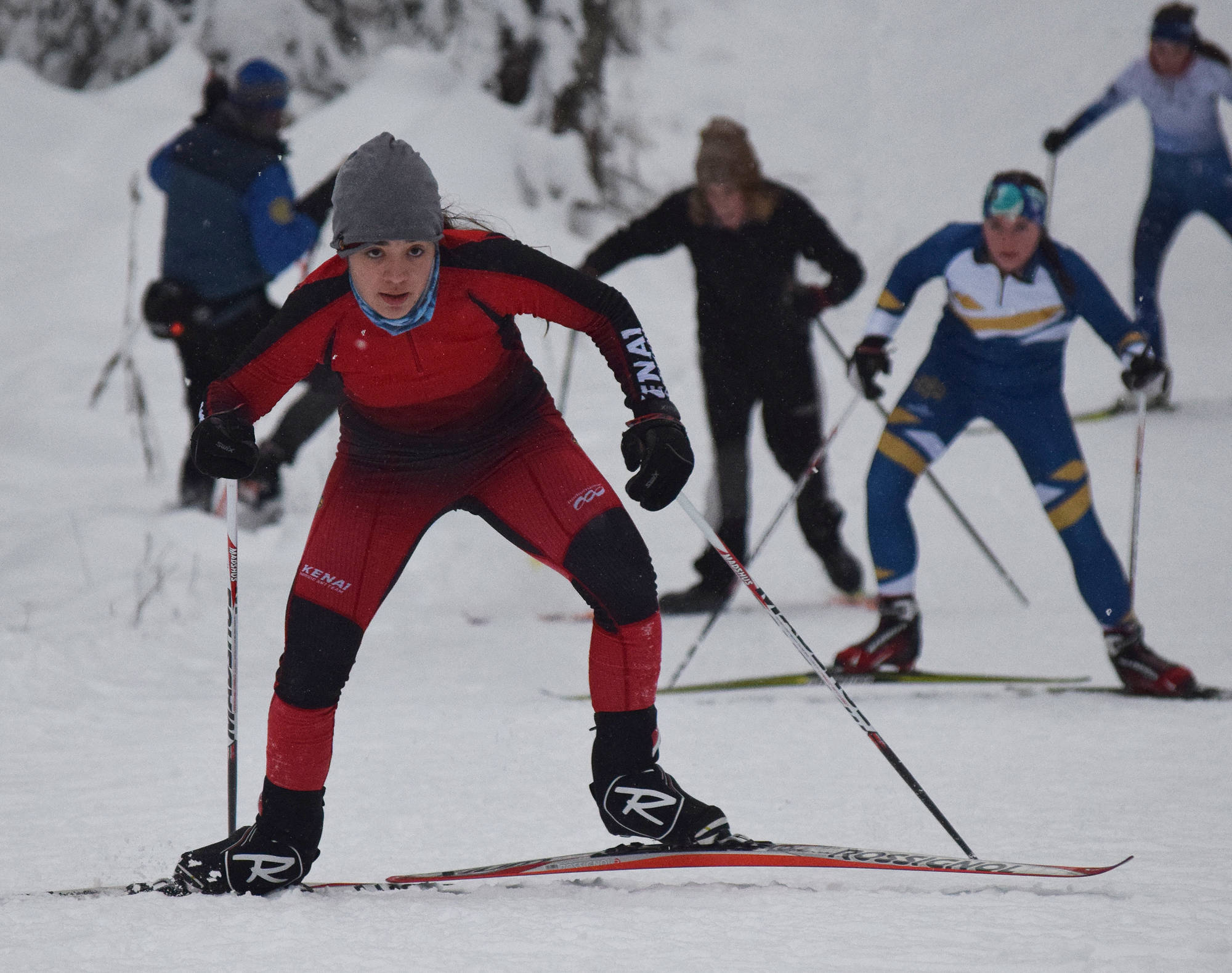 Kenai Central’s Maria Salzetti leads a group of racers up Kill Bill hill Tuesday afternoon, Nov. 21, 2017, at the Turkey Skate race on the Tsalteshi Trails in Soldotna, Alaska. (Photo by Joey Klecka/Peninsula Clarion)