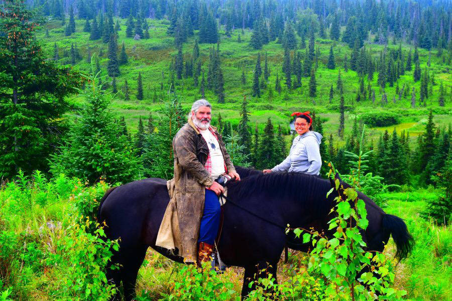 Ron Wilhoit with WWOOFer China Mayo at Alaska Draft Horse. (Photo by Jennifer Tarnacki)