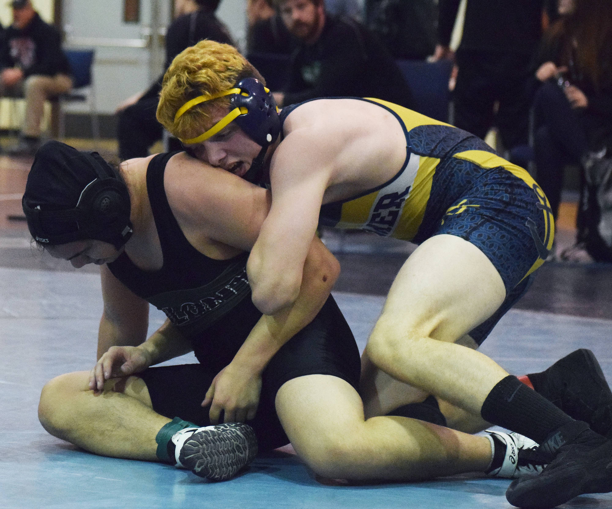 Homer’s Chris Cudaback (right) wrestles with Frank Urbano of Colony in a 170-pound battle at the North-South tournament Saturday, Dec. 2, 2017 at Soldotna Prep School in Soldotna, Alaska. (Photo by Joey Klecka/Peninsula Clarion)
