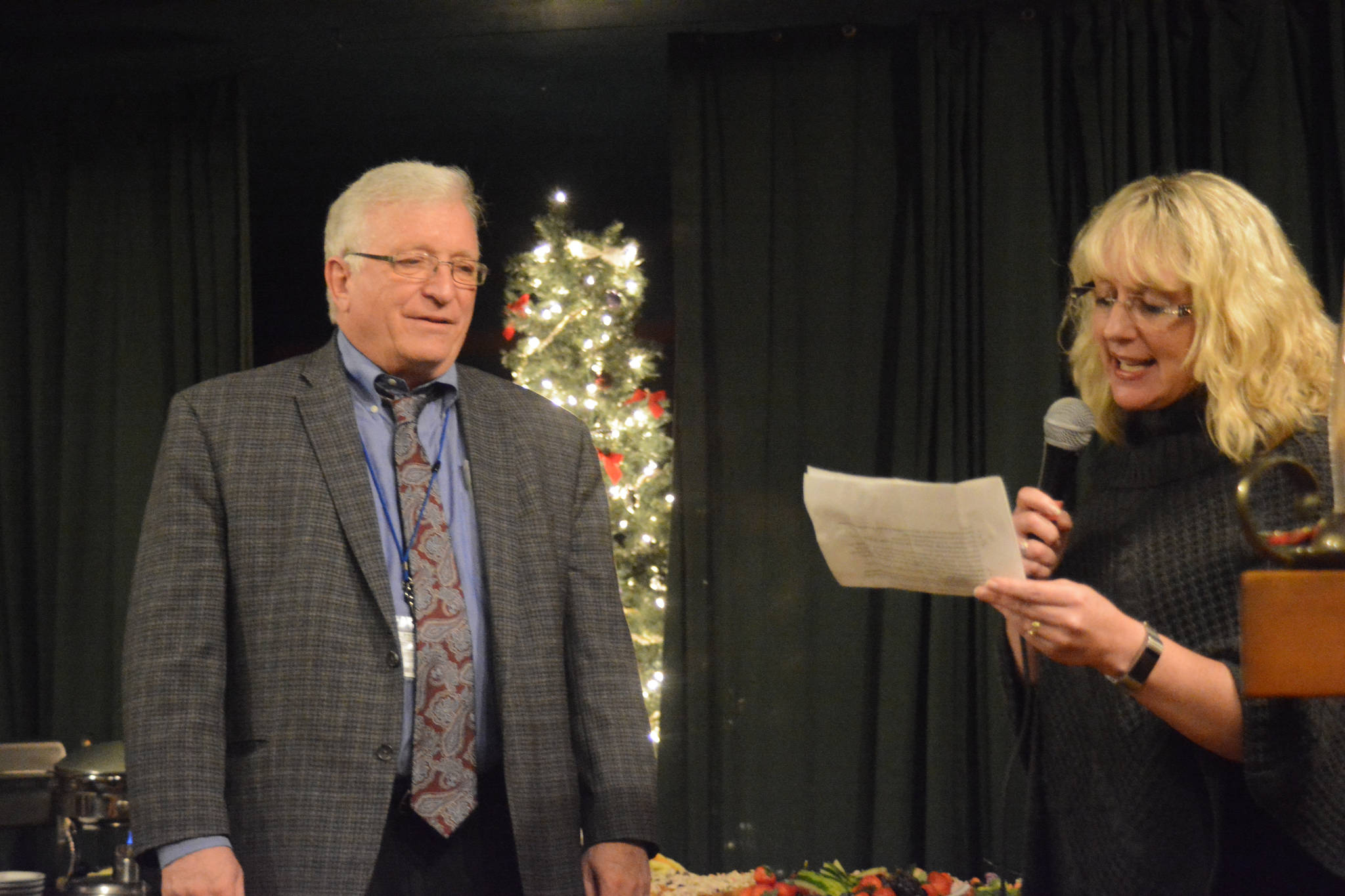 Julie Woodworth, president of the South Peninsula Hospital Board of Directors, praises SPH CEO Bob Letson at a going-away party last Thursday, Nov. 30, 2017 at AJ’s OldTown Steakhouse in Homer, Alaska. Woodworth listed his accomplishments over the past 10 years of his service, including expanding health services, steering new construction, adding new physicians and health providers, and tripling hospital revenues. “Bob has been committed to SPH and community. He wore the hat of CEO seven days a week and was on call all the time,” she said. “…He has created a thriving rural, community hospital. Thank you, Bob. You’ve created a legacy.” (Photo by Michael Armstrong, Homer News)
