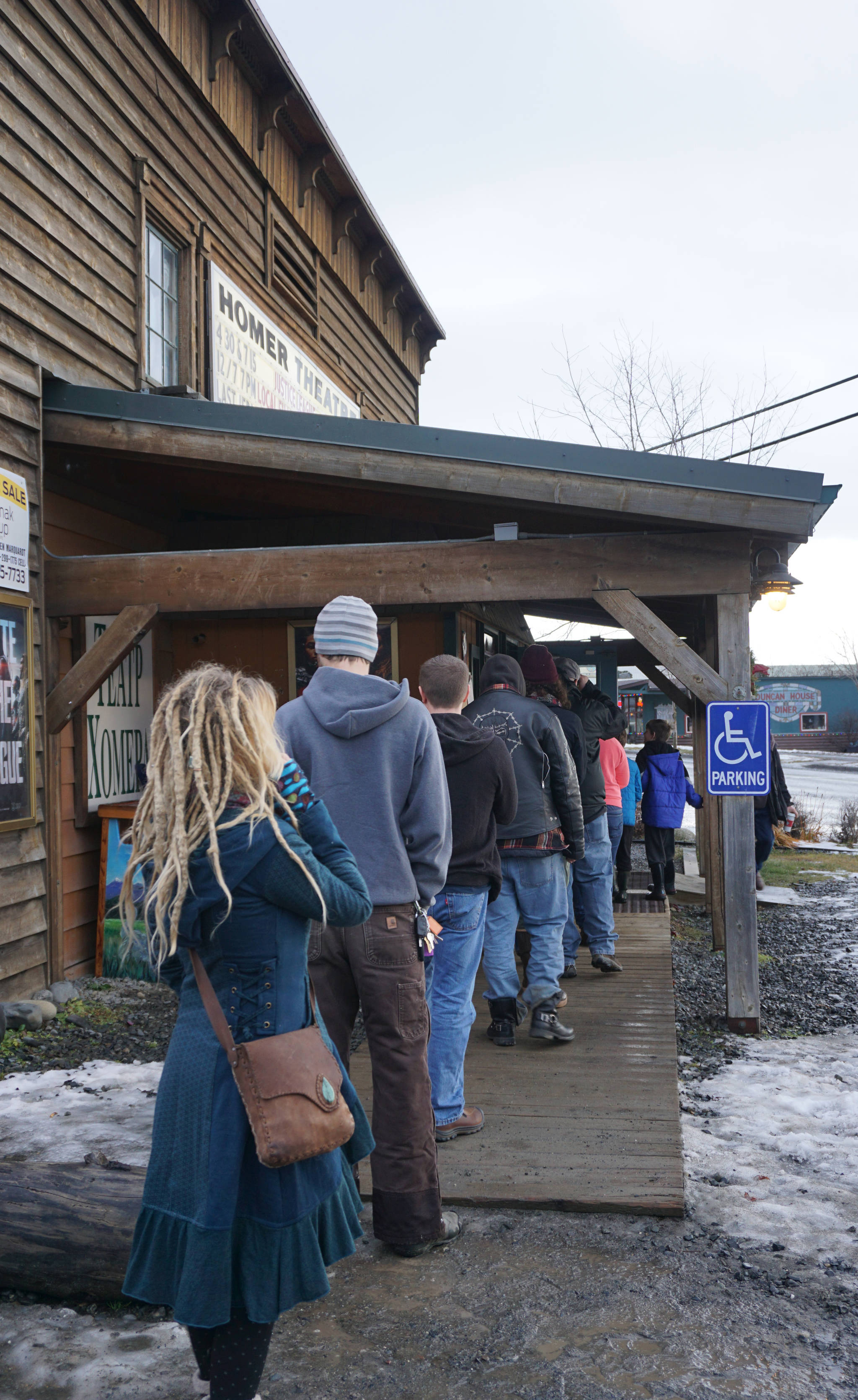 A line of about 25 people wait to buy tickets for the Homer premiers of “Star Wars: The Last Jedi” about noon Saturday, Dec. 2, 2017, at the Homer Theatre in Homer, Alaska. Tickets went on sale for a gala opening night on Dec. 14 as well as shows that weekend. (Photo by Michael Armstrong, Homer News)