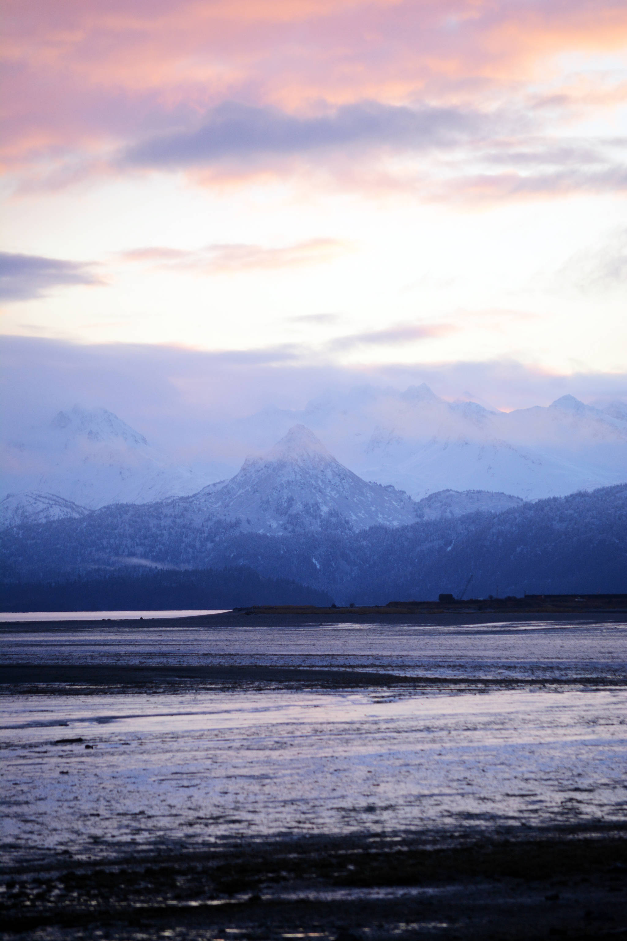 The sun rises over the Homer Spit and the Kenai Mountains on Wednesday, Jan. 3, 2018. On Thursday there will be 6 hours and 17 minutes of daylight, a gain of 13 minutes from last week. (Photo by Michael Armstrong/Homer News)