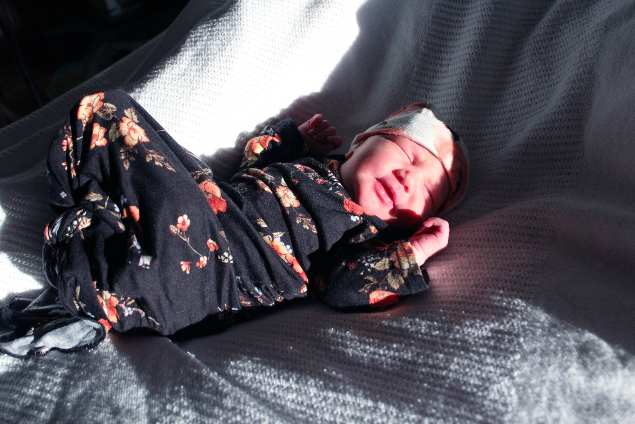 Brooke Addison Buzga stretches in the sun Friday, Jan. 5, 2018 at South Peninsula Hospital in Homer, Alaska. Born on Jan. 4 at 8:29 a.m., she was the first baby of the New Year in Homer. (Photo by Megan Pacer/Homer News)