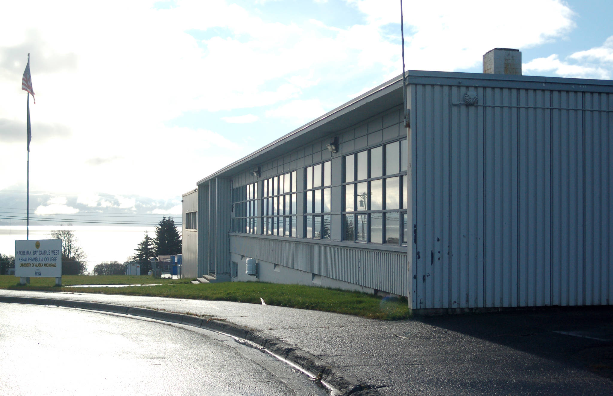 The HERC Building as seen in a 2010 file photo from the upper parking lot at Woodside Avenue. At the time the Kachemak Bay Campus used the building as temporary office and classroom space while the Pioneer Avenue building was being remodeled, one of several uses of the HERC since the city acquired it from the Kenai Peninsula Borough in 2000. (Homer News file photo)