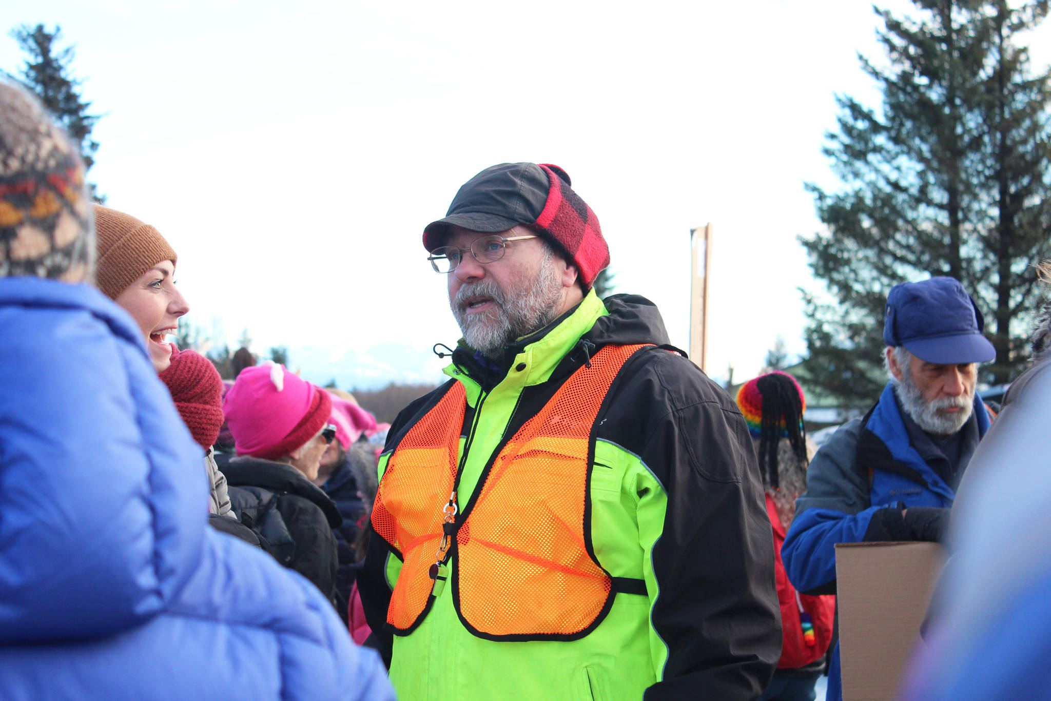 Kenai Peninsula Borough Assembly Member Willy Dunne mingles with Homer area residents shortly before the Women’s March on Homer 2018, in the parking lot of the HERC Building, on Saturday, Jan. 20, 2018 in Homer, Alaska. (Photo by Megan Pacer/Homer News)