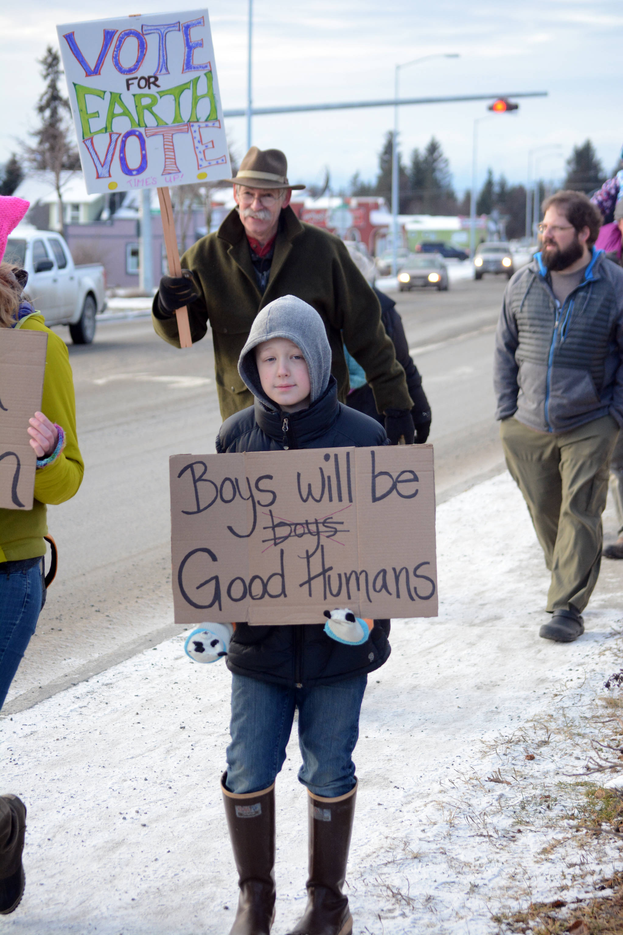 Elliott Greet, 11, walks in the Homer March for Women on Saturday. He said he marched for “equality between genders.” When asked how boys should treat girls, he said, “Be nice to them. Treat them how you would want to be treated.” (Photo by Michael Armstrong/Homer News)