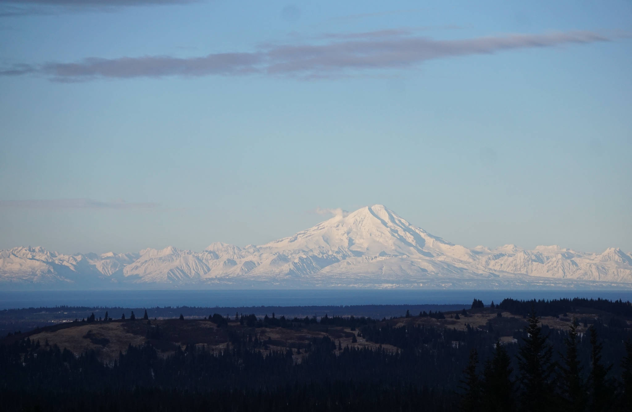 Steam rises from Redoubt Volcano on Sunday afternoon, Jan. 21, as seed from Diamond Ridge. (Photo by Michael Armstrong, Homer News)