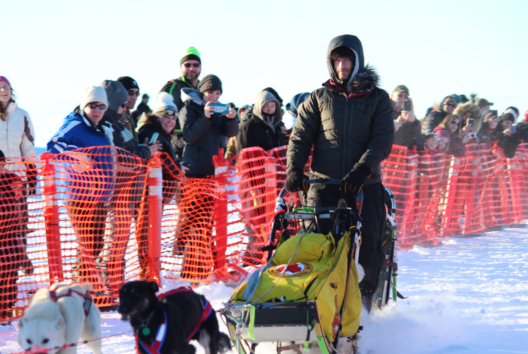 Musher Nicolas Petit takes off with his team from the starting line of this year’s Tustumena 200 Sled Dog Race on Saturday, Jan. 27, 2018 at Freddie’s Roadhouse in Ninilchik, Alaska. Petit, who took second place in last year’s T200, was the first to start this year and also the first to reach the McNeil Canyon checkpoint. (Photo by Megan Pacer/Homer News)