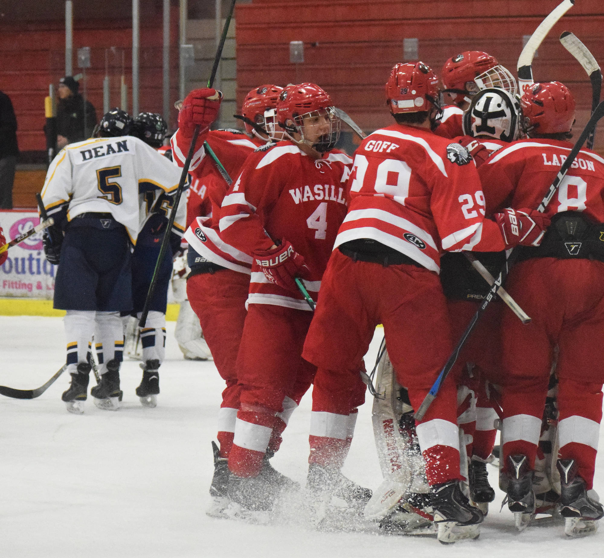 The Wasilla Warriors celebrate a 4-2 semifinal victory over Homer, Friday at the North Star Conference tournament at the Soldotna Regional Sports Complex. (Photo by Joey Klecka/Peninsula Clarion)