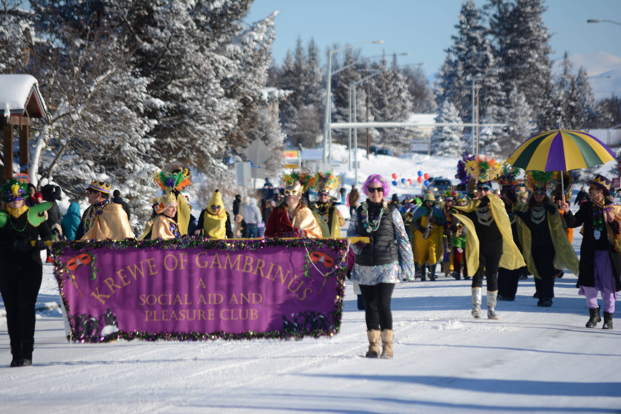 The Krewe of Gambrinus marches in the Homer Winter Carnival parade on Saturday. They won Best of Show in the parade contest. (Photo by Michael Armstrong, Homer News)