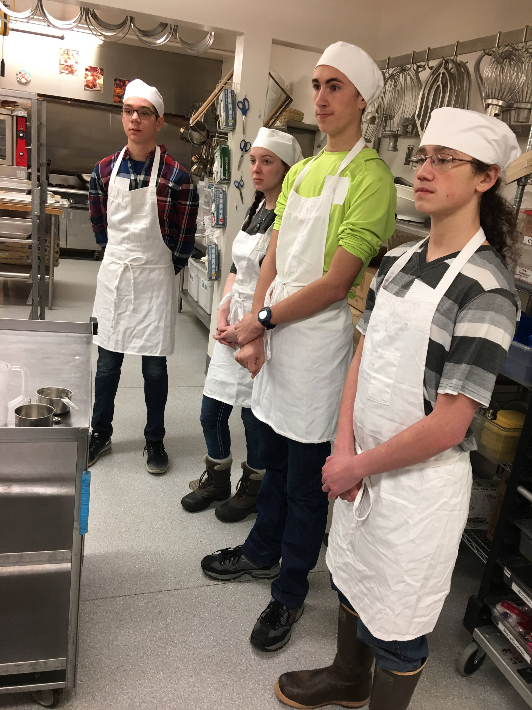 Thirteen Homer High School students visited the Alaska Vocational Training Education Center in Seward on Feb. 8 to tour their programs. These four students chose the culinary program to shadow. From left to right are Desmond Vanliere, Sariah Whaley, Andy Super, Isaac Jump. Other students went to Welding, Electrical, and Welding. All the students were pretty serious about attending AVTEC in their chosen field. The school district’s Career and Technical Education program paid for the trip and the over night accommodations (Photo by Lin Hampson)