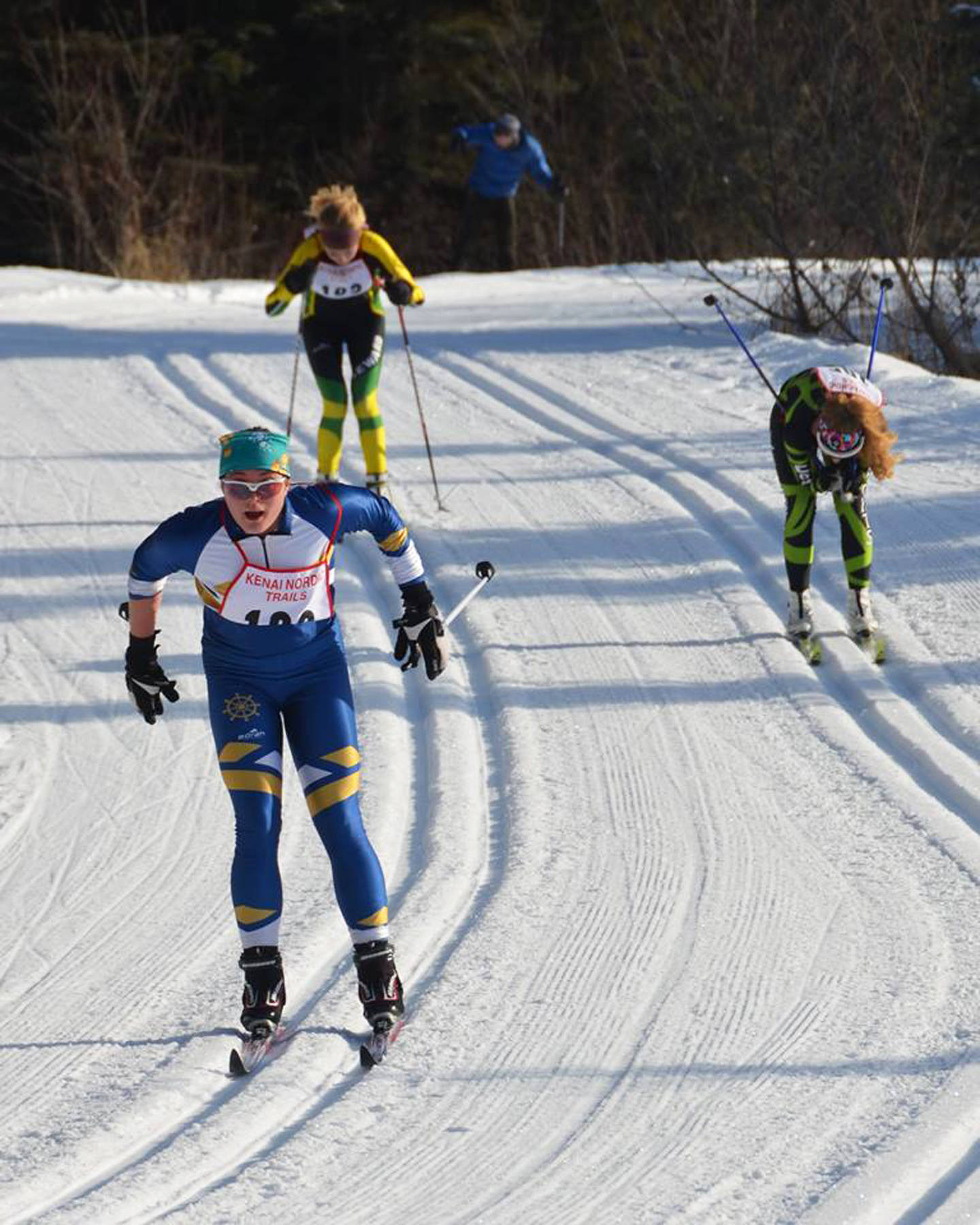 Homer’s Katia Holmes leads Seward’s Ruby Lindquist and Colony’s Alyson Kopsack down the final hill of the girls’ 5-kilometer classic race to claim fourth place Saturday, Feb. 17, 2018 during the Region III Ski Championships at Tsalteshi Trails in Soldotna, Alaska. (Photo by Janna Davis)