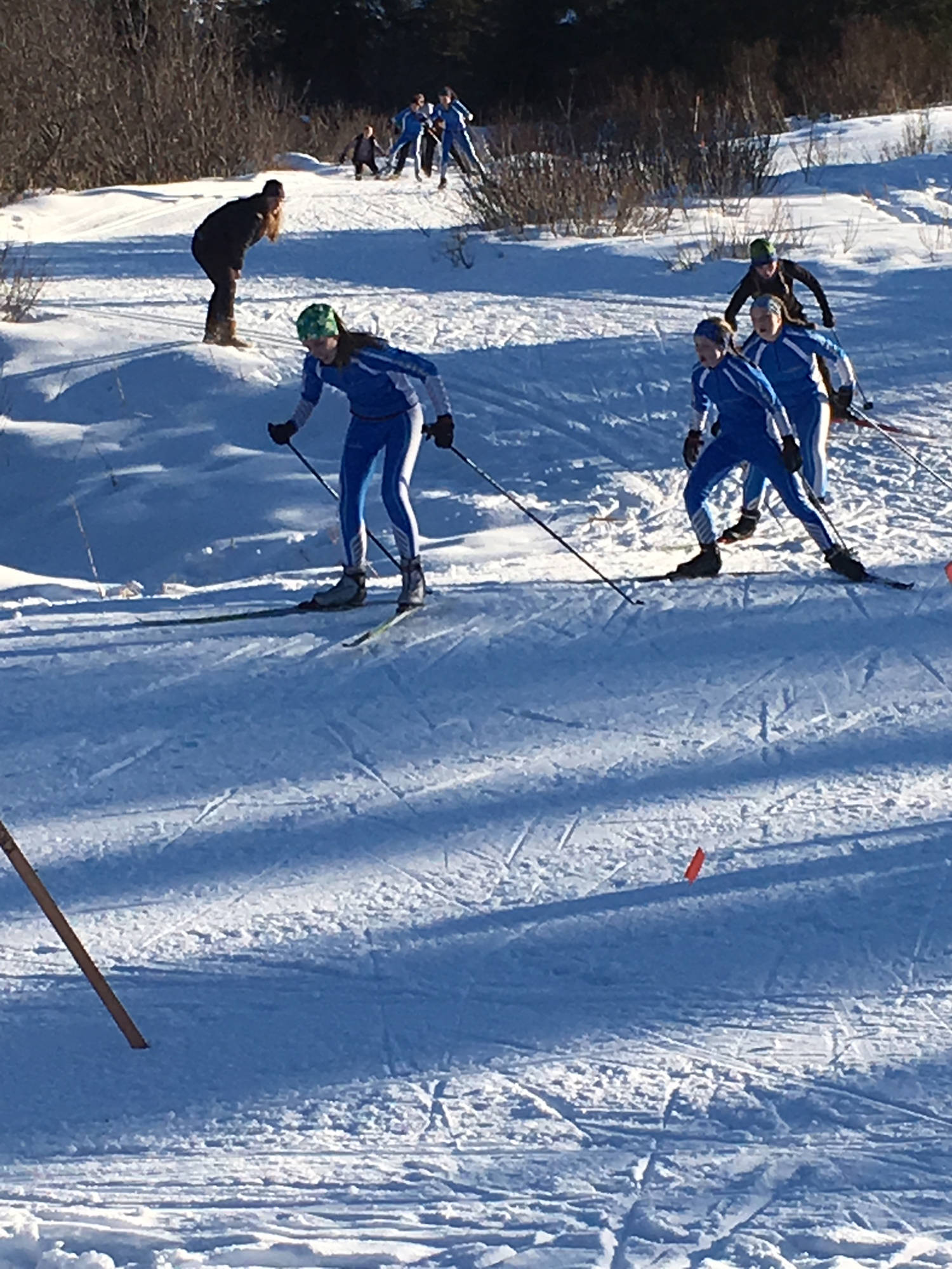 Homer Middle School cross-country skiers Delta Fabich, Hannah Stonorov and Olivia Glasman (foreground), and Delilah Harris and Eryn Field (background) race about the course Friday, Feb. 16 at the Lookout Mountain Ski Trails near Homer, Alaska. (Photo submitted)