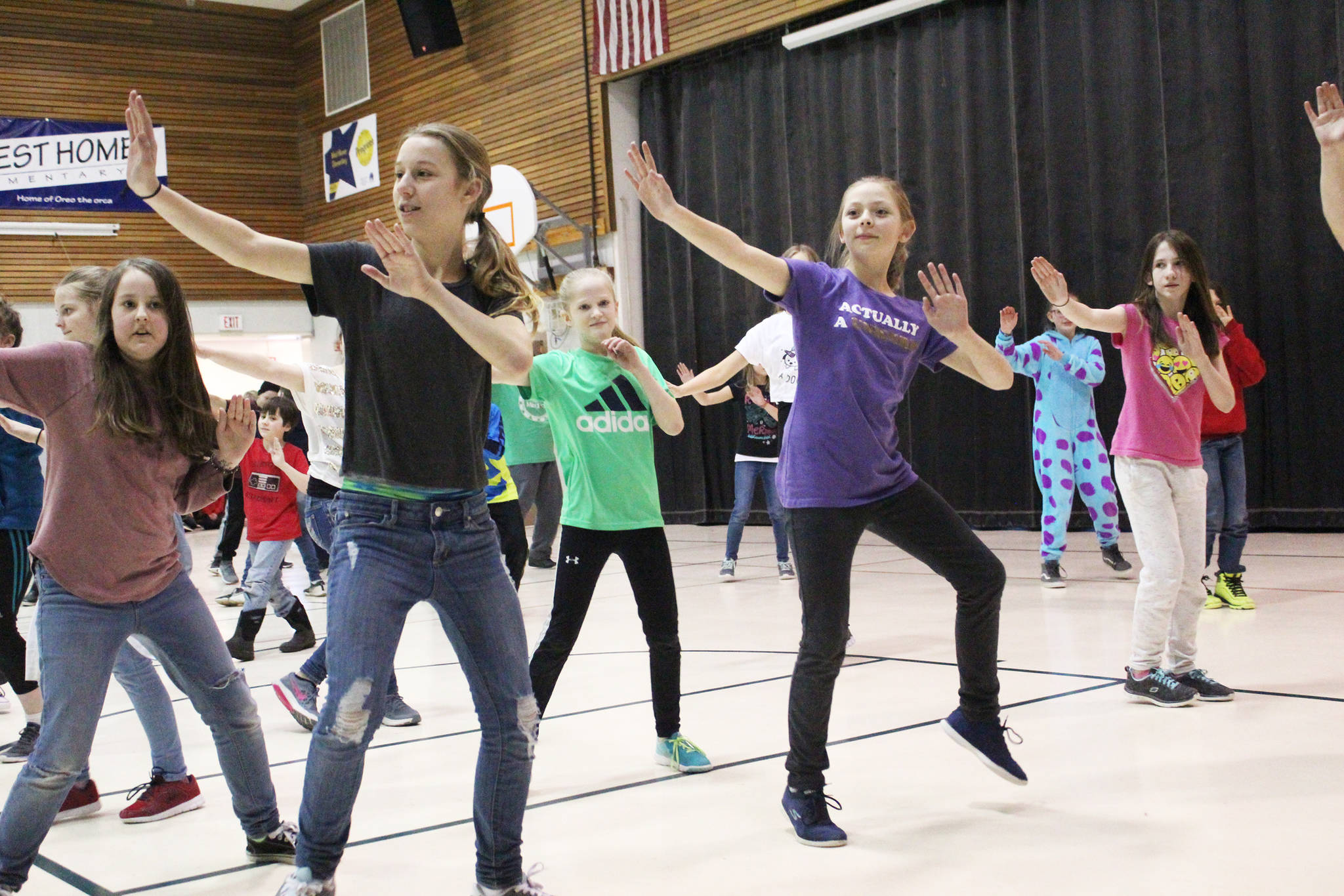 Students perform one o the dances they learned from Artist in the School resident Jocelyn Shiro during a recital for parents Friday, Feb. 23, 2018 at West Homer Elementary School in Homer, Alaska. (Photo by Megan Pacer/Homer News)