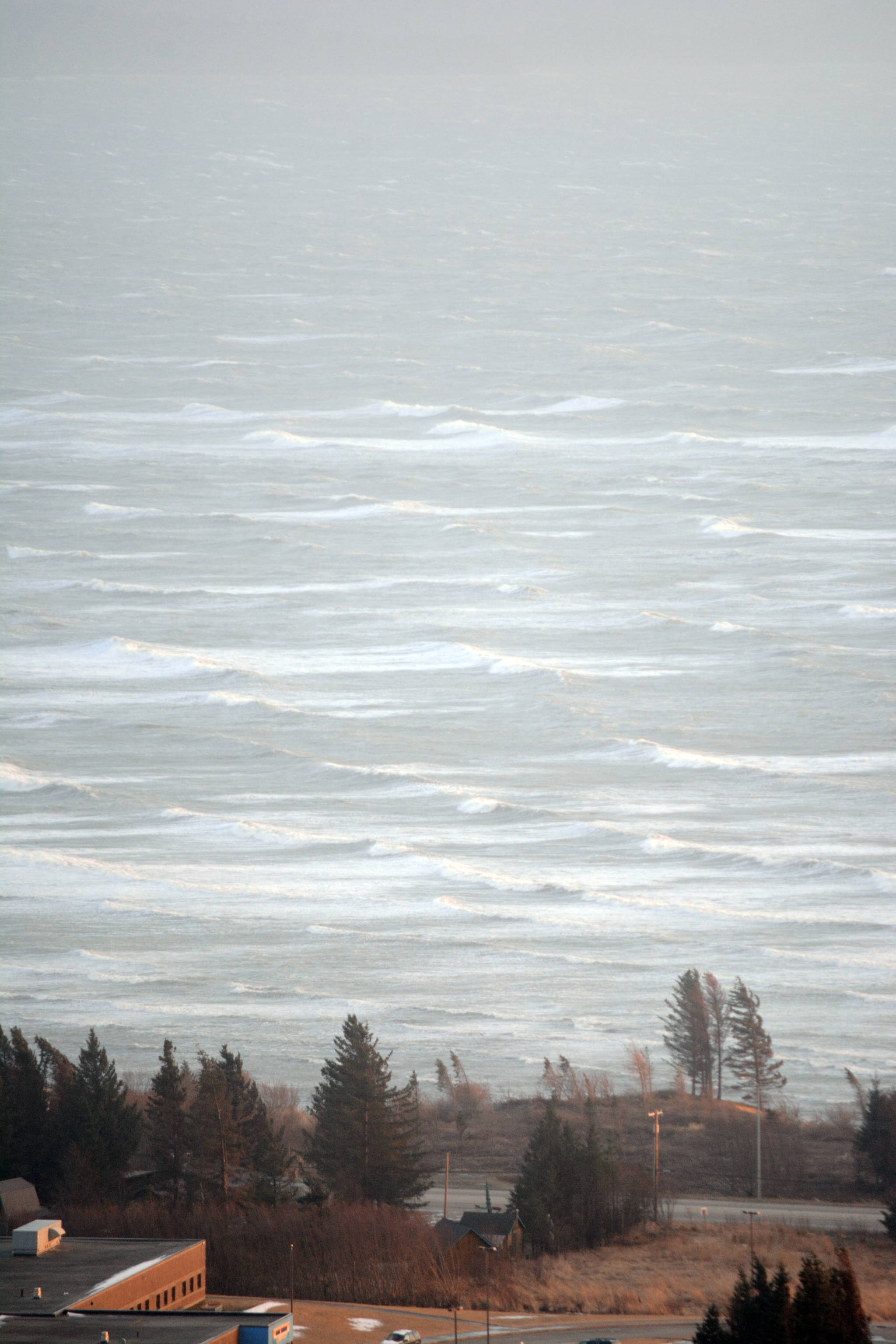 High waves blow on Kachemak Bay about 6 p.m. Monday, Feb. 26, 2018 as seen from West Hill Road in Homer, Alaska. The storm caused power outages on the lower Kenai Peninsula and high winds caused drifts on area roads, including Ohlson Mountain Road. (Photo by Michael Armstrong/Homer News)