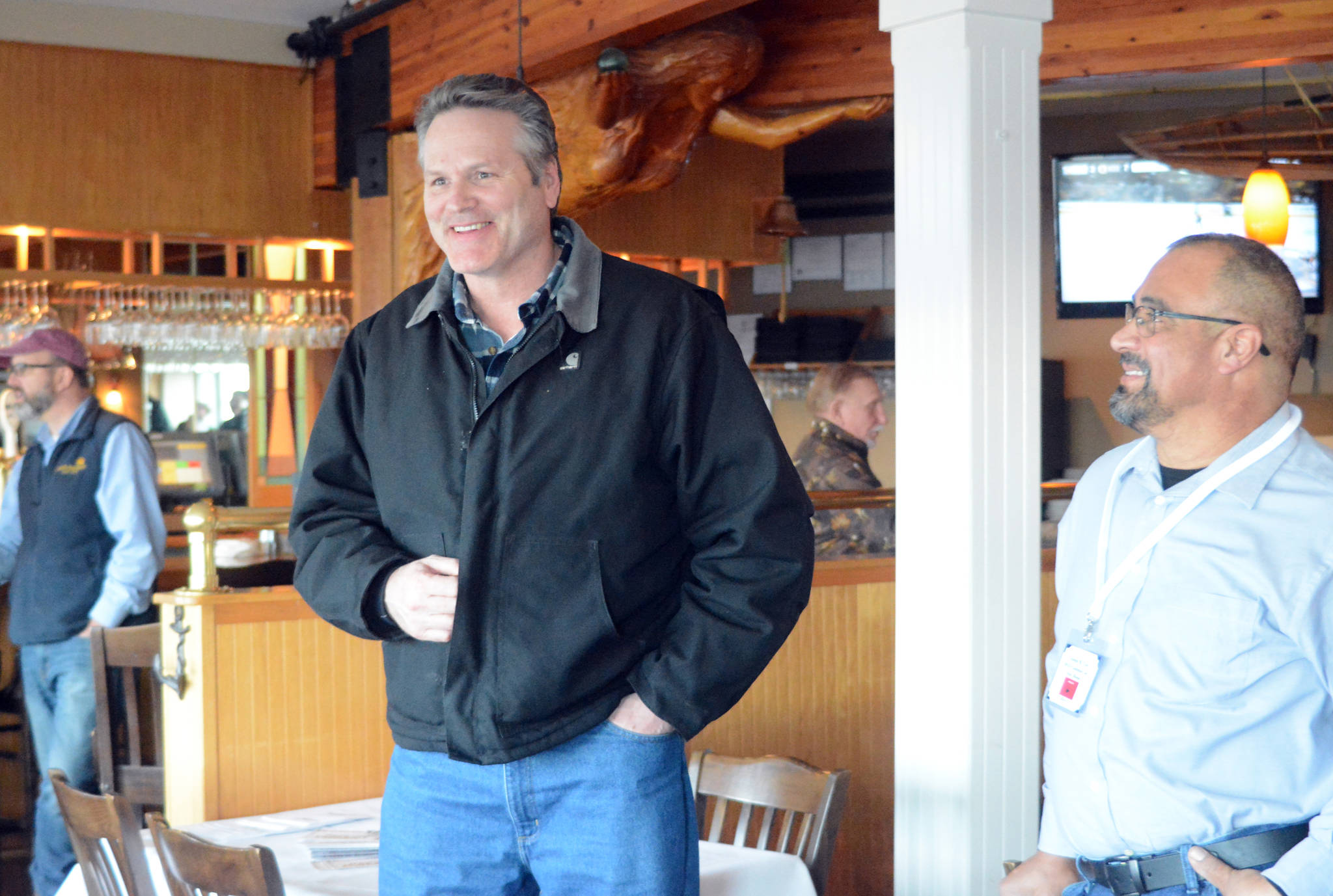 Republican Party candidate Mike Dunleavy, left, speaks Thursday, March 1, 2018 at Land’s End Resort in Homer, Alaska, as John Cox of Anchor Point, right, listens. Cox is running for the Republican Party nomination for District 31 representative. (Photo by Michael Armstrong/Homer News)