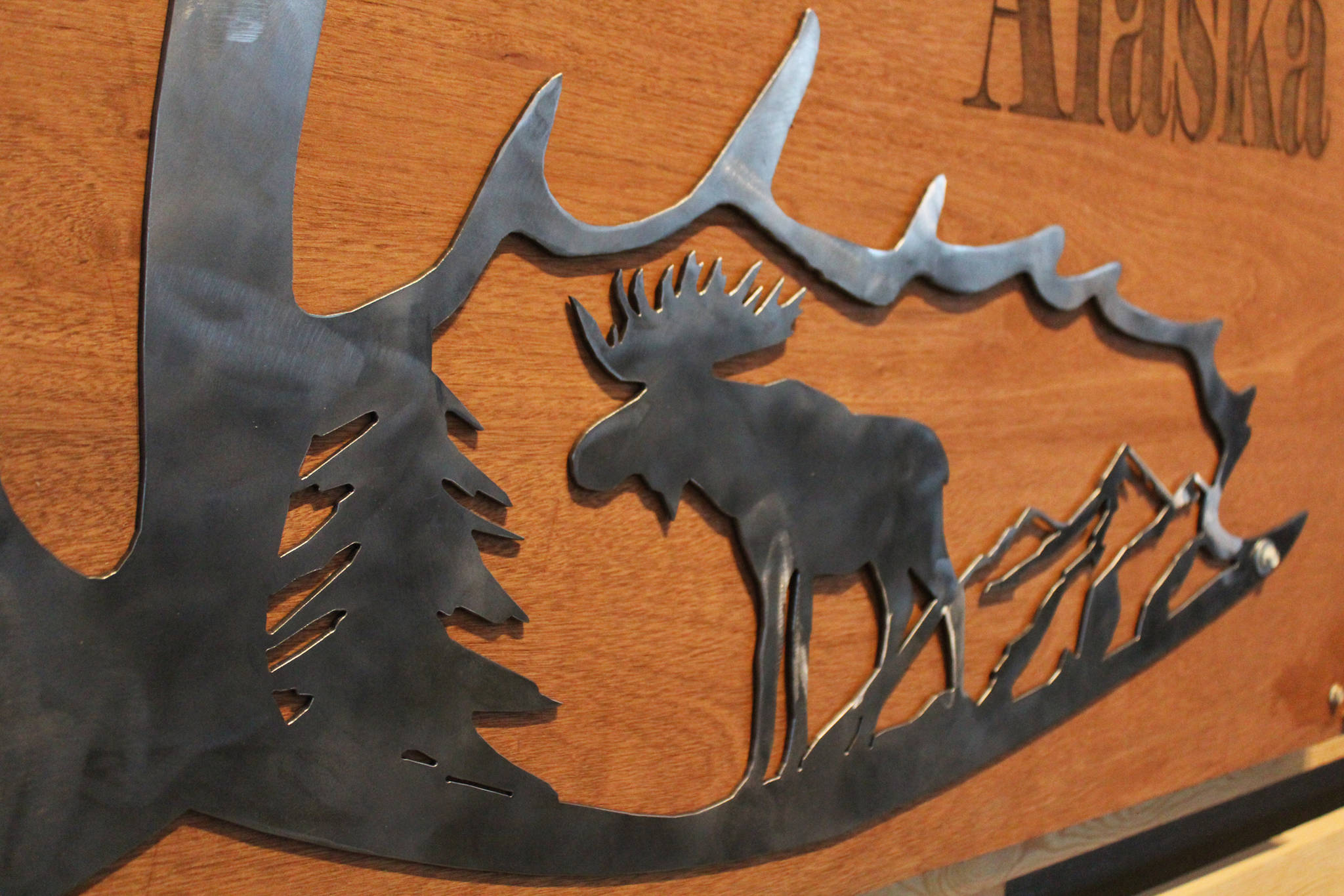 A closeup of a piece of art created by Homer High School freshman Riley Jones shows the details of his design while the piece is displayed during a First Friday art show Friday, March 2, 2018 at Grace Ridge Brewery In Homer, Alaska. Jones was one of several students at the high school to have their creations displayed. (Photo by Megan Pacer/Homer News)